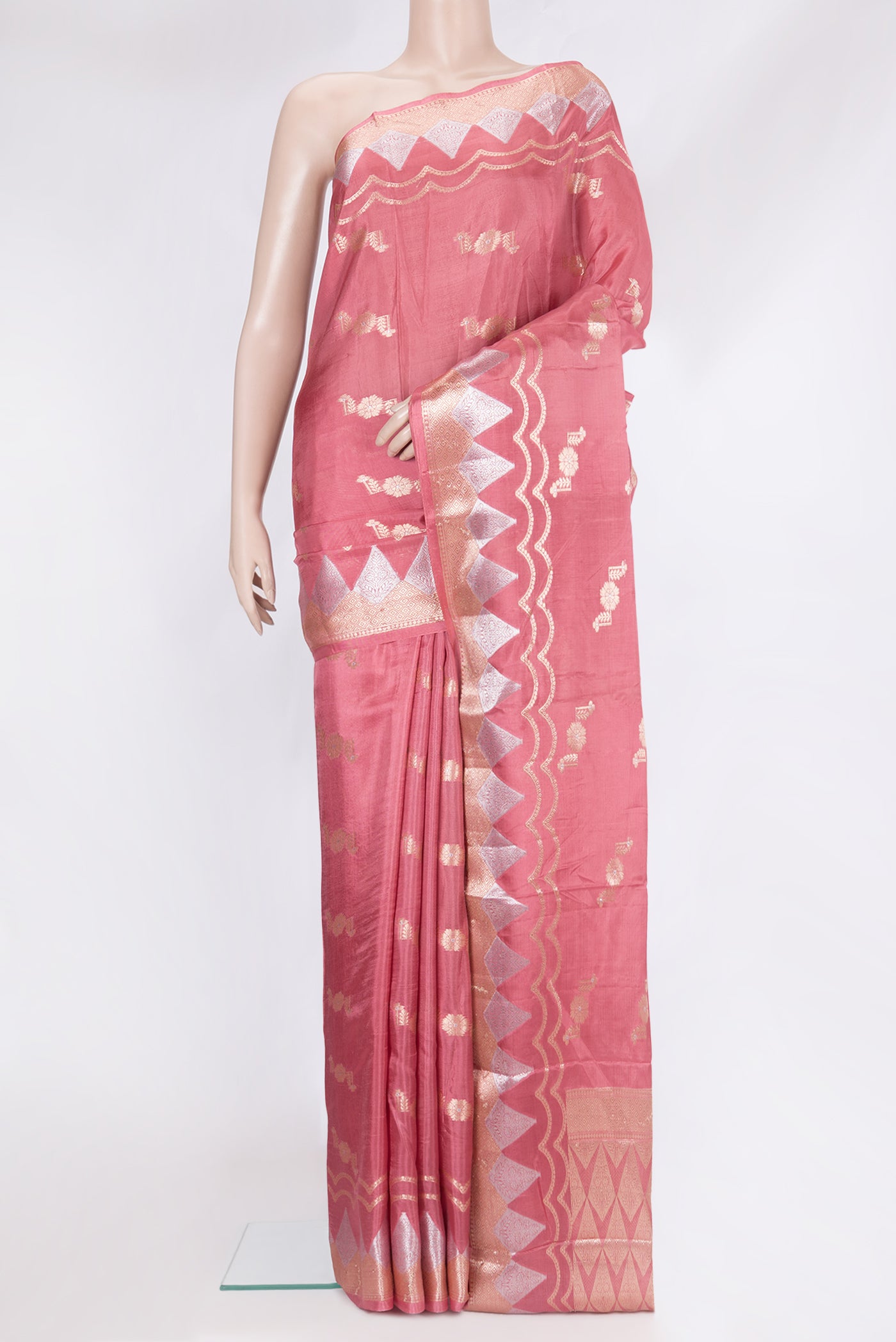 Coral Tussar Silk Saree with Zari Butta on the body and Fancy Border.  displayed on a mannequin