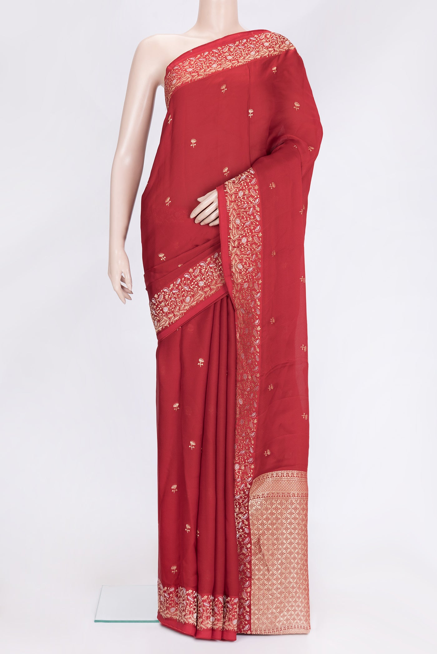 Maroon Dual Tone Banarasi Georgette Saree with Embroidery on the body and Fancy Border.  displayed on a mannequin