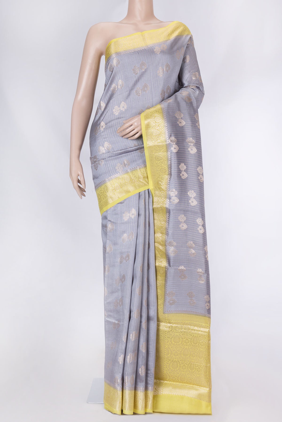 Lilac Banarasi Raw Silk Saree with Zari Butta on the body and Zari Border displayed on a mannequin