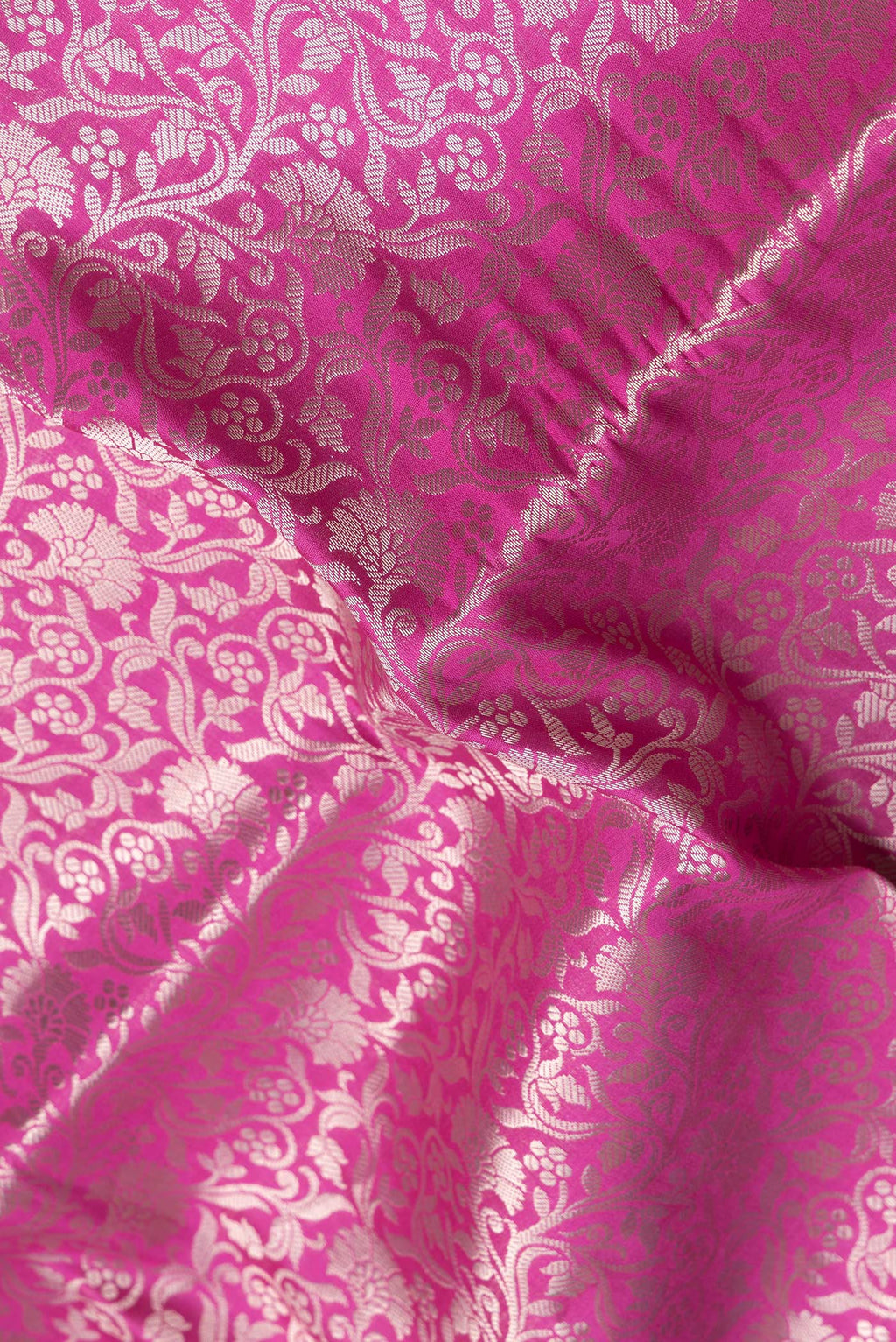 Close up of Pink Dual Tone Tussar Silk Saree with Zari Brocade on the body and Zari Border.  displaying folds