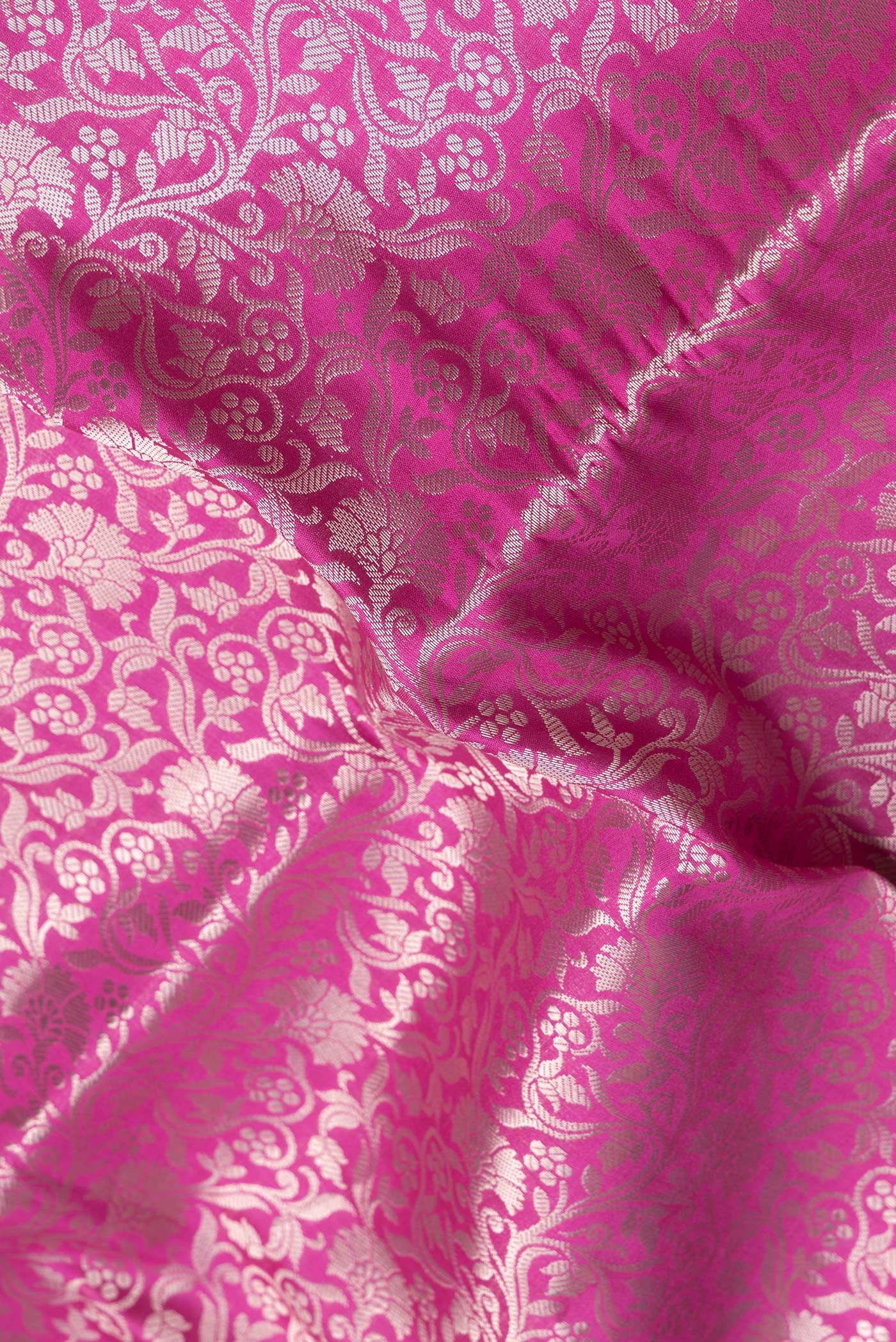Close up of Pink Dual Tone Tussar Silk Saree with Zari Brocade on the body and Zari Border.  displaying folds