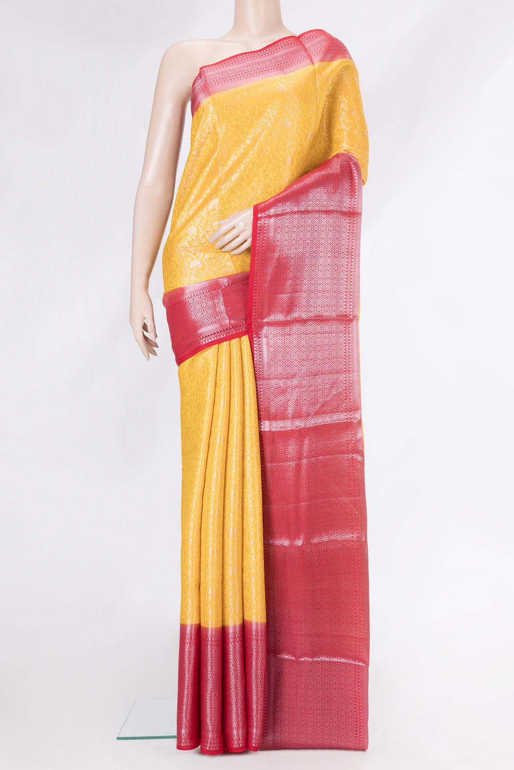 Yellow Dual Tone Banarasi Raw Silk Saree with Zari Brocade on the body and Zari Border.  displayed on a mannequin