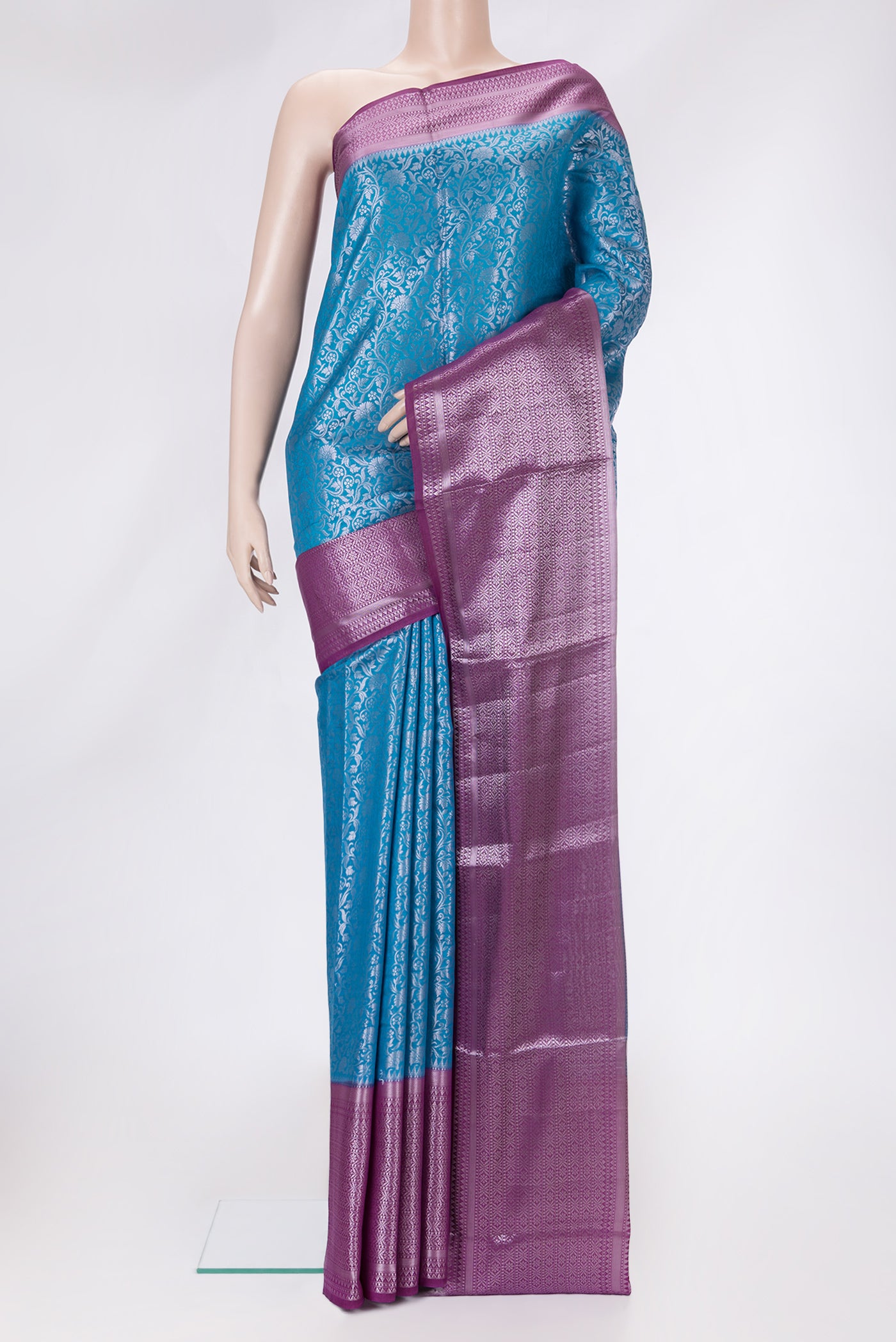 Sky Blue Dual Tone Tussar Silk Saree with Zari Brocade on the body and Zari Border.  displayed on a mannequin