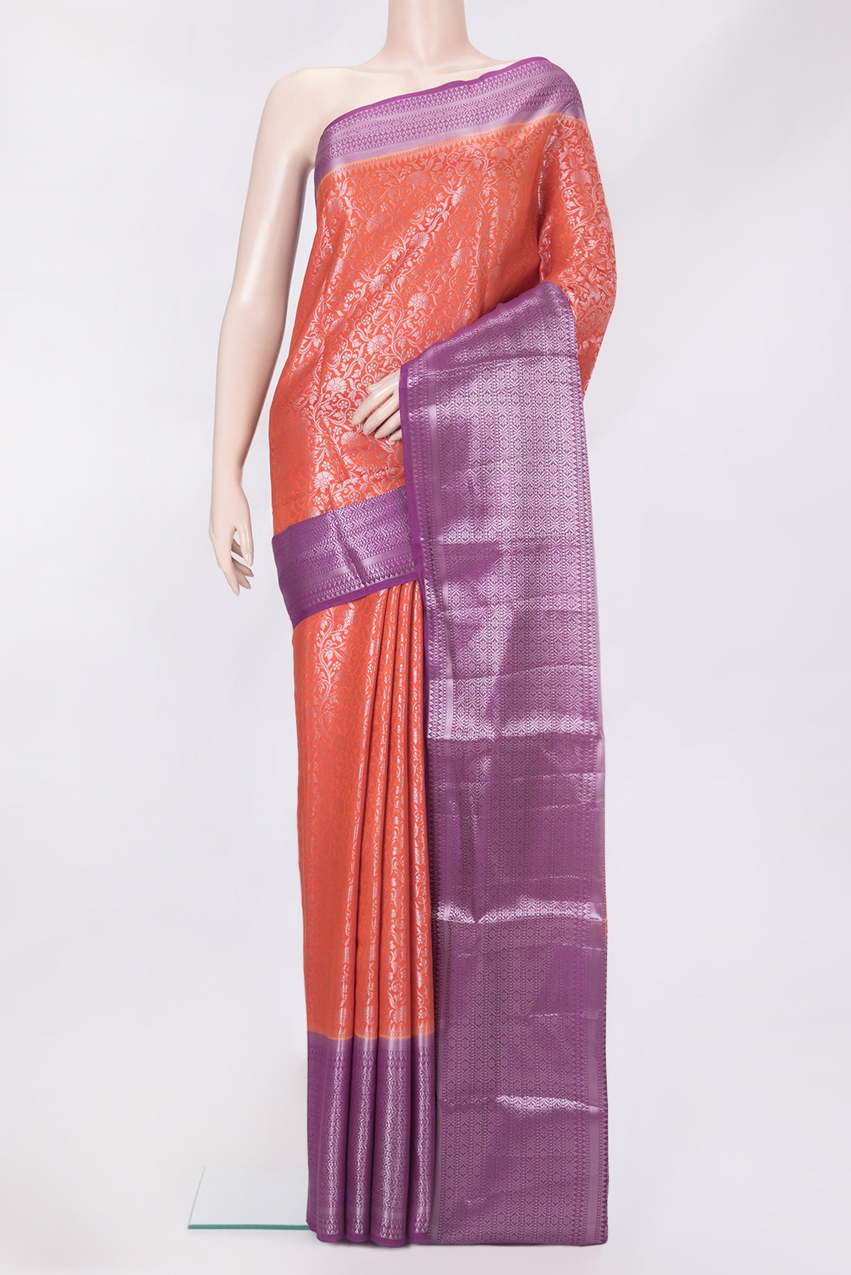 Orange Tussar Silk Saree with Zari Brocade on the body and Zari Border.  displayed on a mannequin