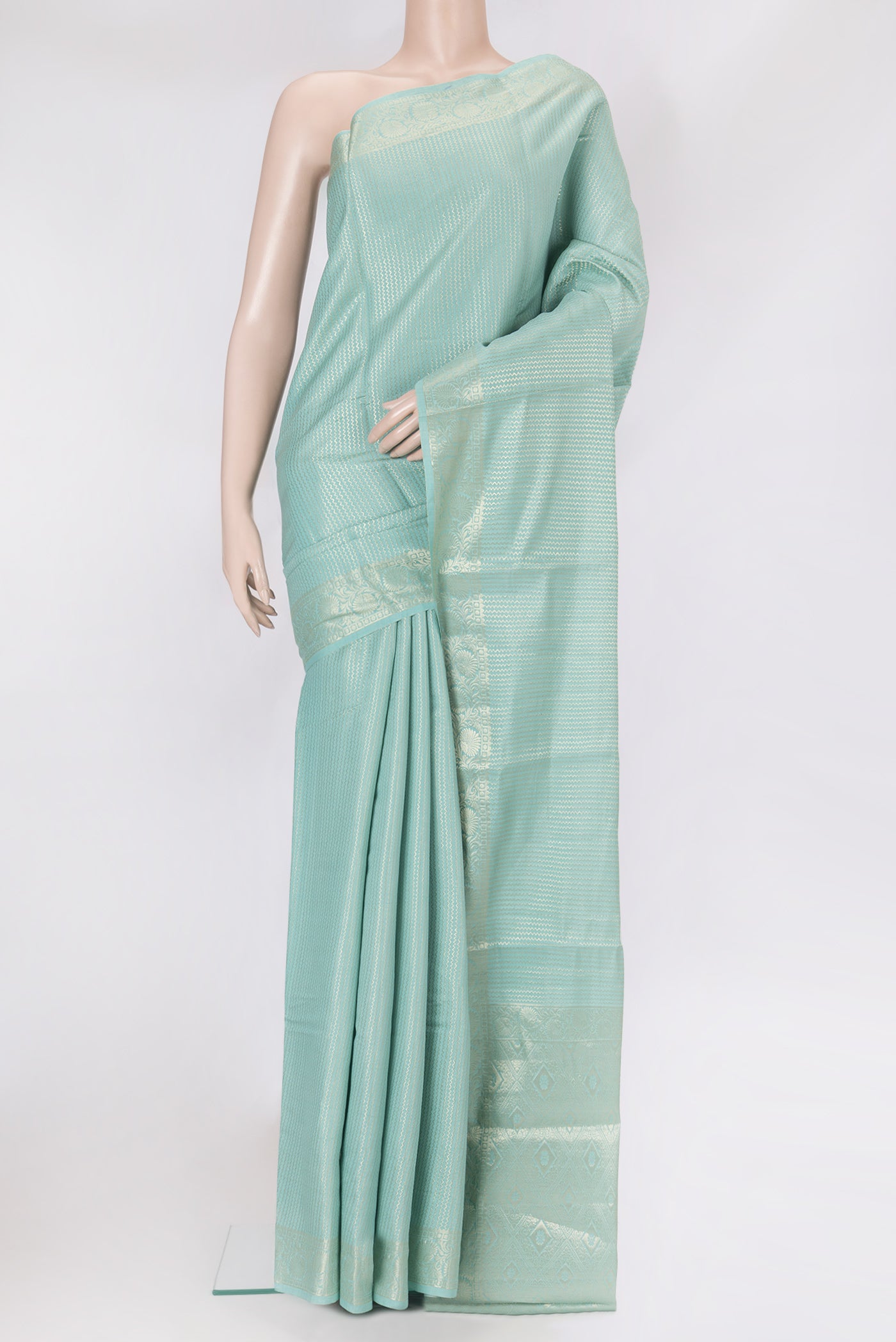 Sky Blue Dual Tone Tussar Silk Saree with Zari Brocade on the body and Zari Border.  displayed on a mannequin