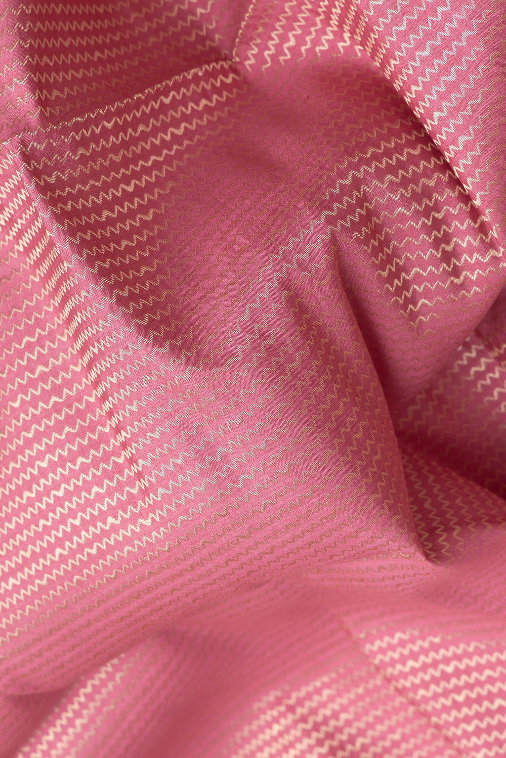 Close up of Pink Dual Tone Banarasi Raw Silk Saree with Zari Brocade on the body and Zari Border.  displaying folds