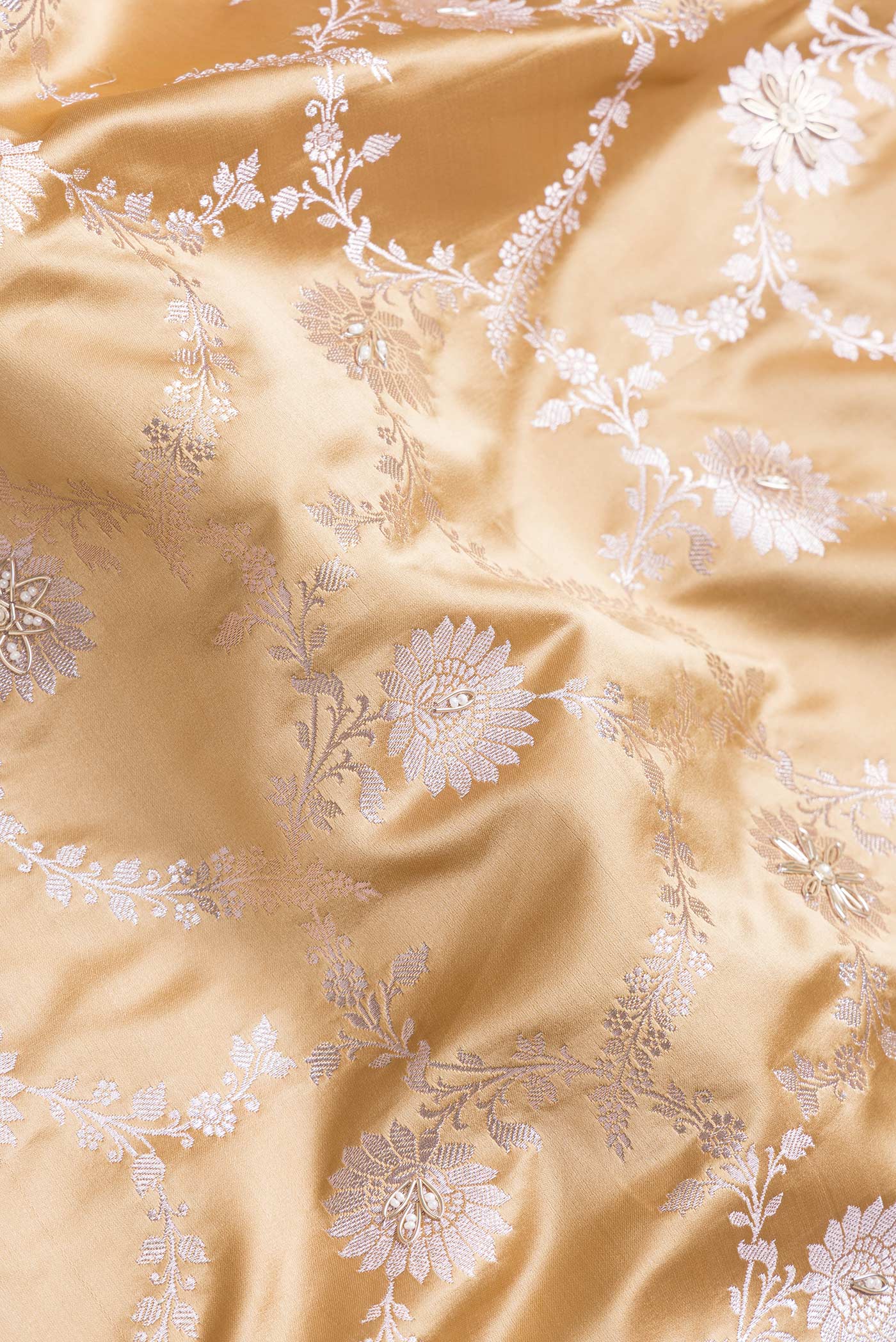 Close up of Sandal Dual Tone Banarasi Silk Saree with Embroidery on the body and Embroidery Border.  displaying folds