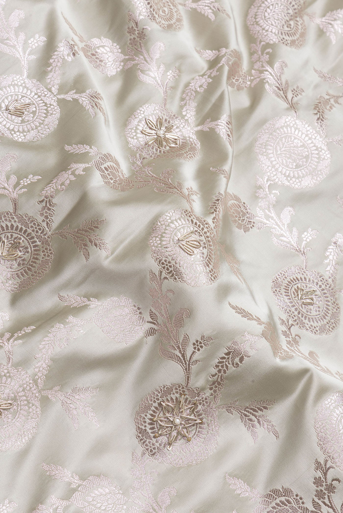 Close up of Grey Dual Tone Banarasi Silk Saree with Embroidery on the body and Embroidery Border.  displaying folds