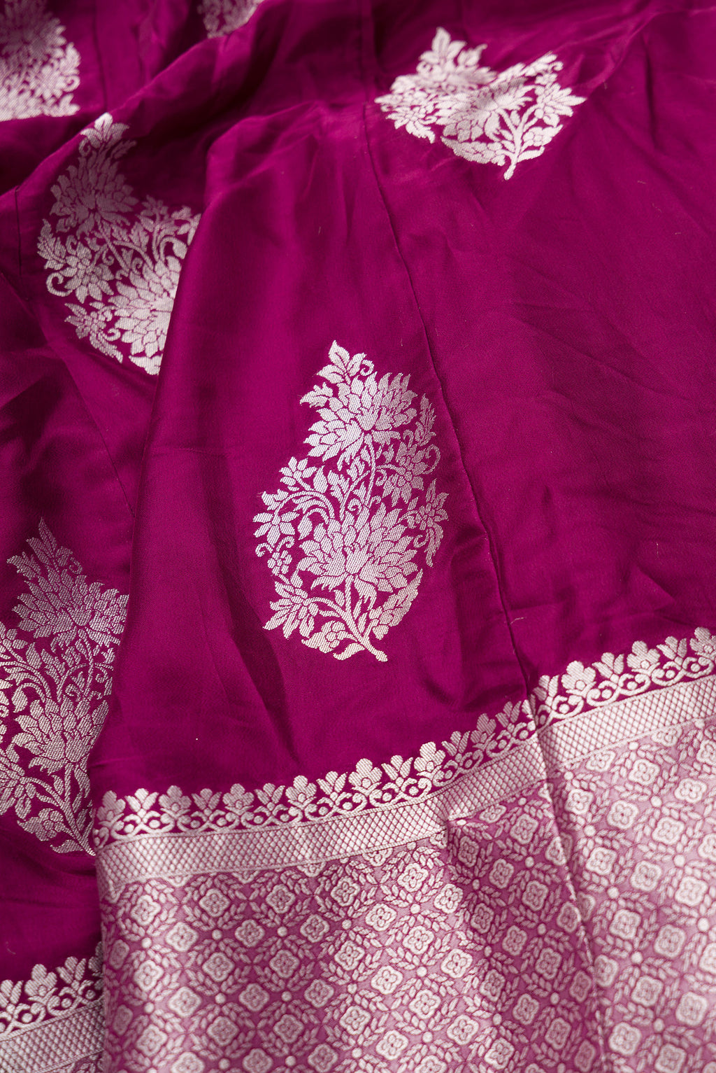 Detailed shot of Burgundy Banarasi Silk Womens Lehenga set featuring Zari Brocade Choli paired with Burgundy Zari Brocade Skirt with Zari Border and a Zari Butta dupatta in Burgundy