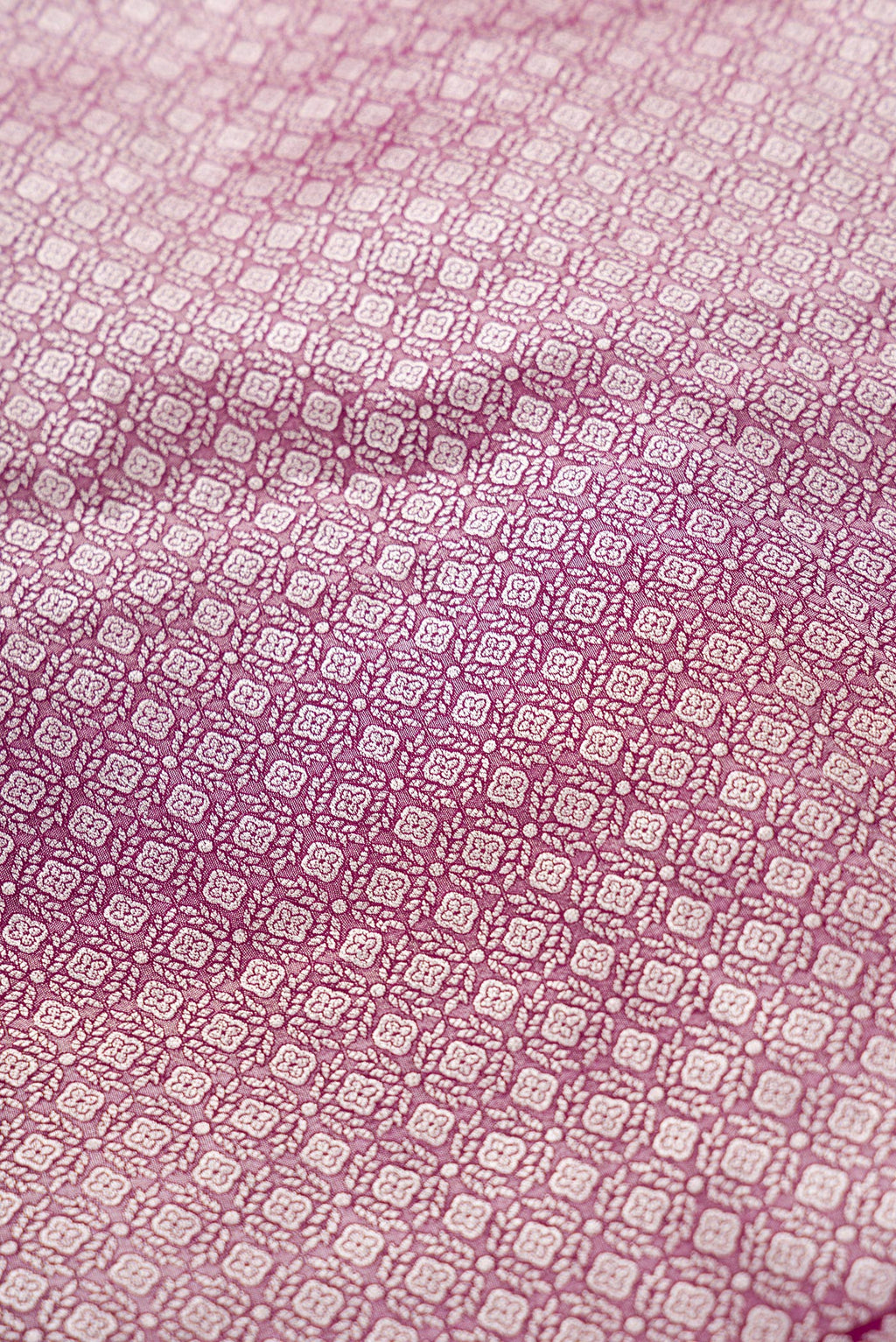 Close up blouse image of Burgundy Banarasi Silk Womens Lehenga set featuring Zari Brocade Choli paired with Burgundy Zari Brocade Skirt with Zari Border and a Zari Butta dupatta in Burgundy