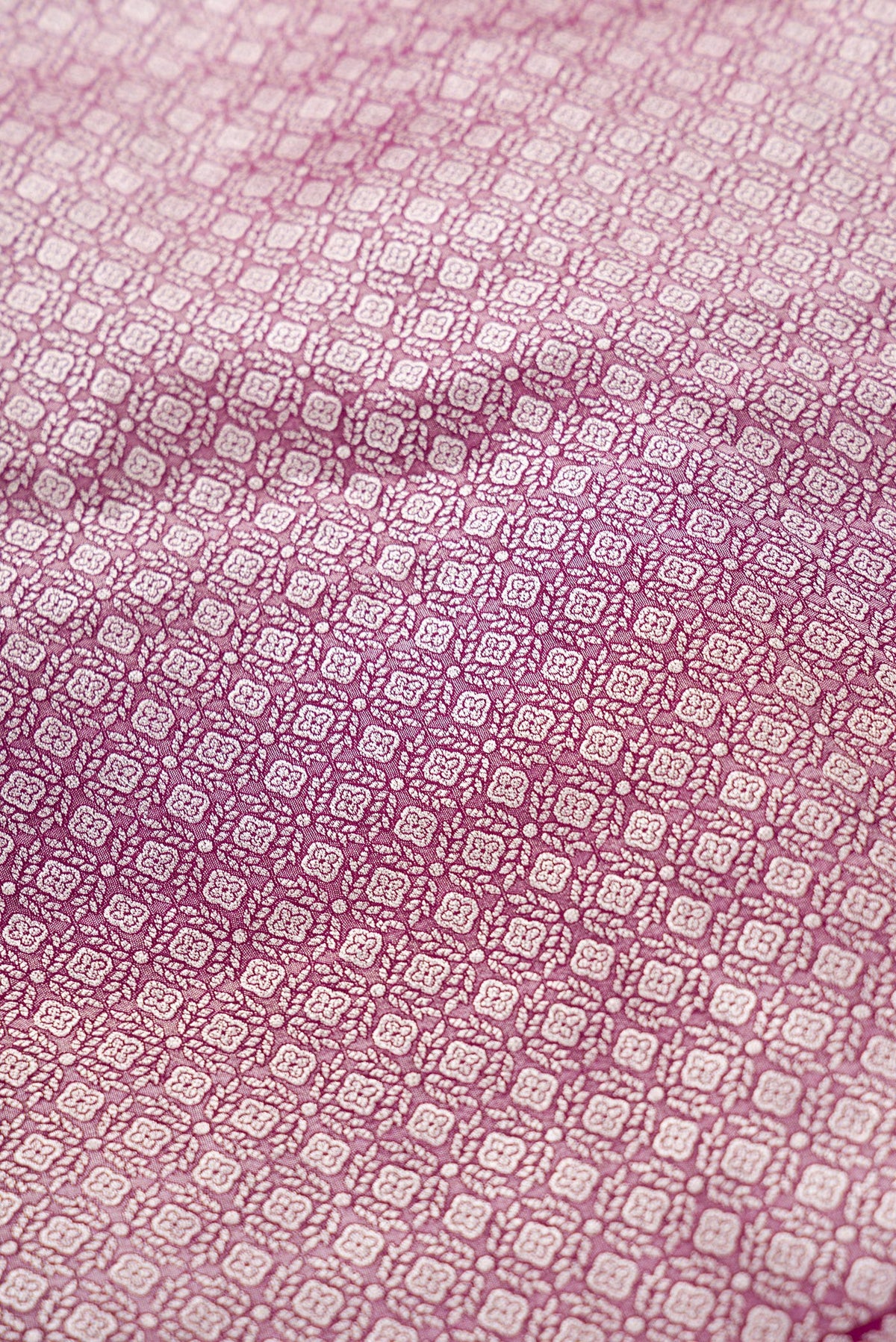 Close up blouse image of Burgundy Banarasi Silk Womens Lehenga set featuring Zari Brocade Choli paired with Burgundy Zari Brocade Skirt with Zari Border and a Zari Butta dupatta in Burgundy