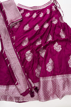 Flat lay of Burgundy Banarasi Silk Womens Lehenga set featuring Zari Brocade Choli paired with Burgundy Zari Brocade Skirt with Zari Border and a Zari Butta dupatta in Burgundy