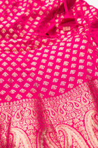 Detailed shot of Dark Pink Banarasi Silk Womens Lehenga set featuring Zari Brocade Choli paired with Dark Pink Zari Brocade Skirt with Zari Border and a Zari Butta dupatta in Dark Pink