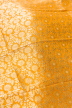 Close up blouse image of Mustard Banarasi Silk Womens Lehenga set featuring Zari Brocade Choli paired with Mustard Zari Brocade Skirt with Zari Border and a Zari Brocade dupatta in Mustard
