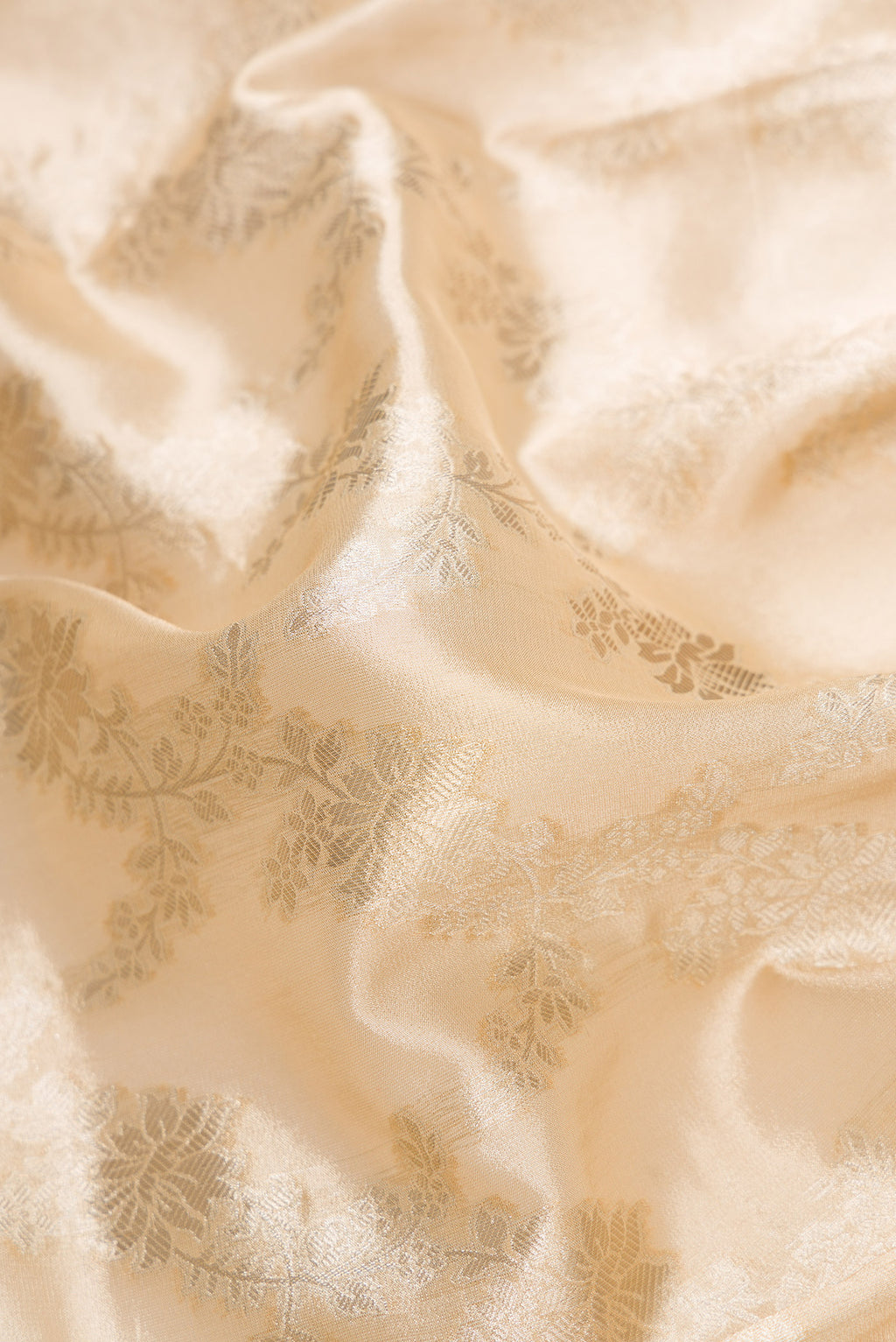 Close up of Sandal Dual Tone Organza Silk Saree with Zari Brocade on the body and Zari Border.  displaying folds