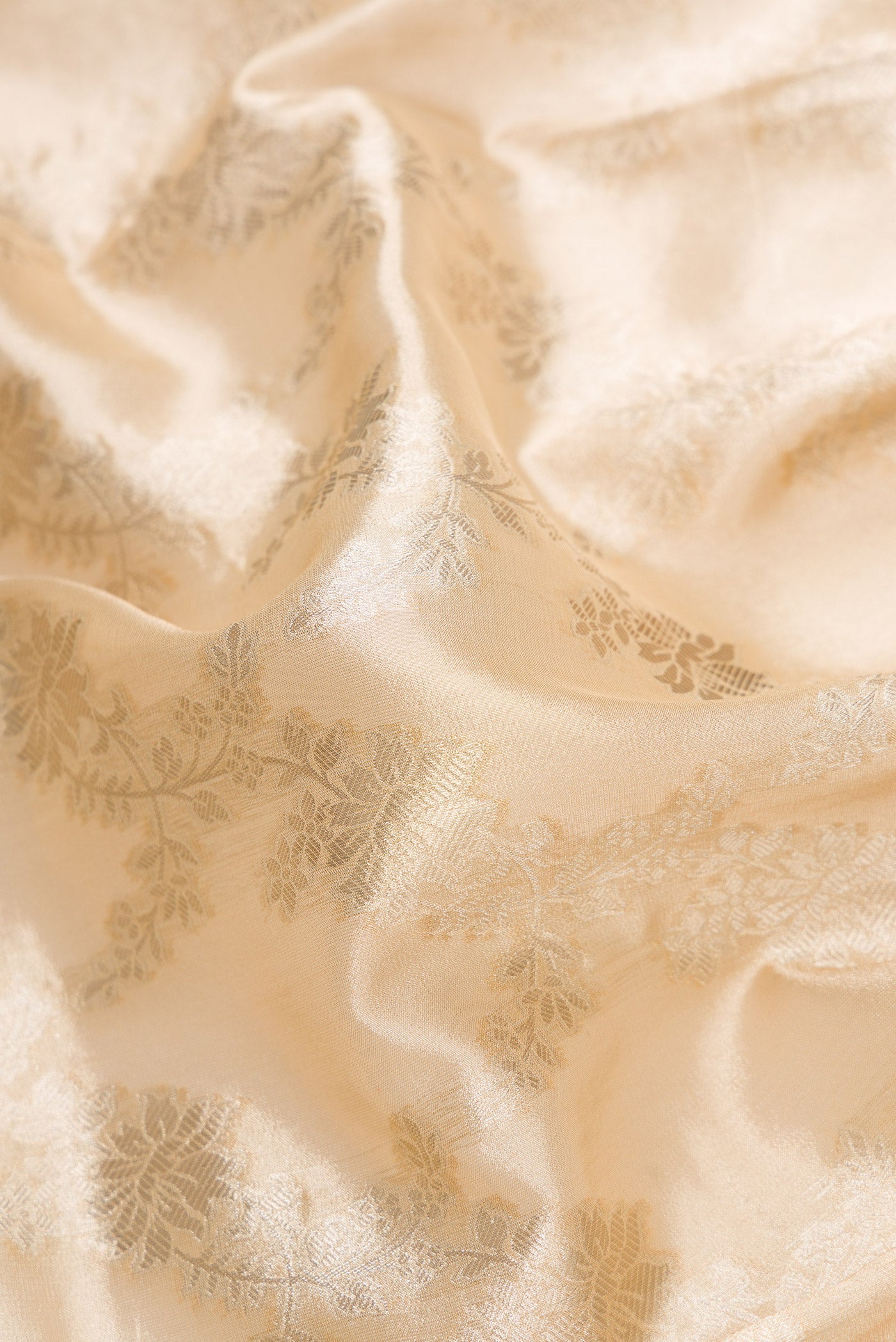 Close up of Sandal Dual Tone Organza Silk Saree with Zari Brocade on the body and Zari Border.  displaying folds