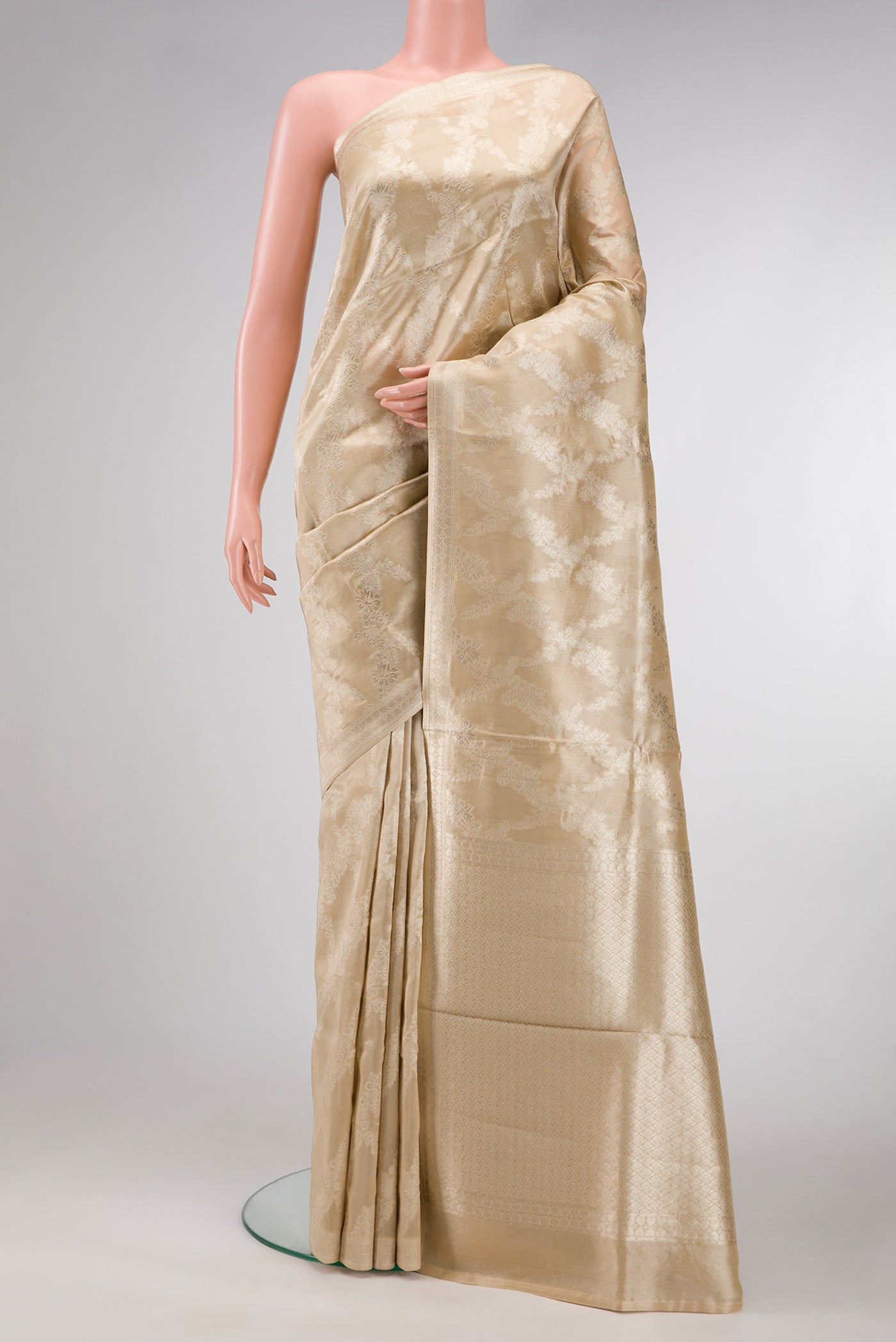 Sandal Dual Tone Organza Silk Saree with Zari Brocade on the body and Zari Border.  displayed on a mannequin