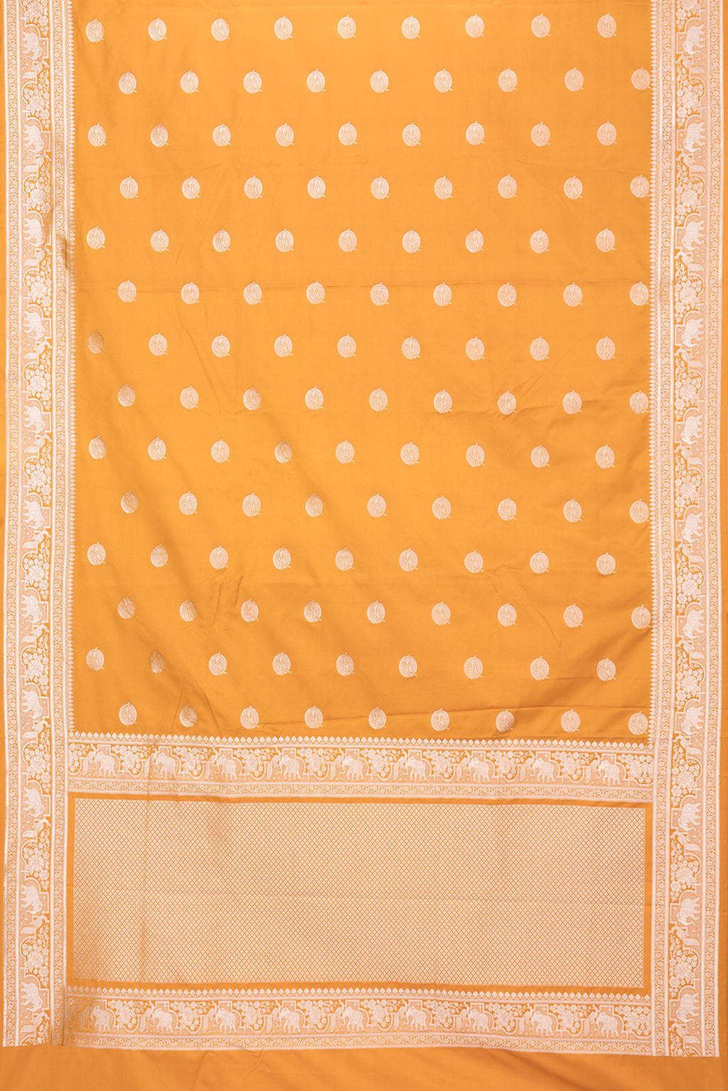 Flat view of Mustard Banarasi Silk Saree with Zari Butta on the body and Zari Border. 