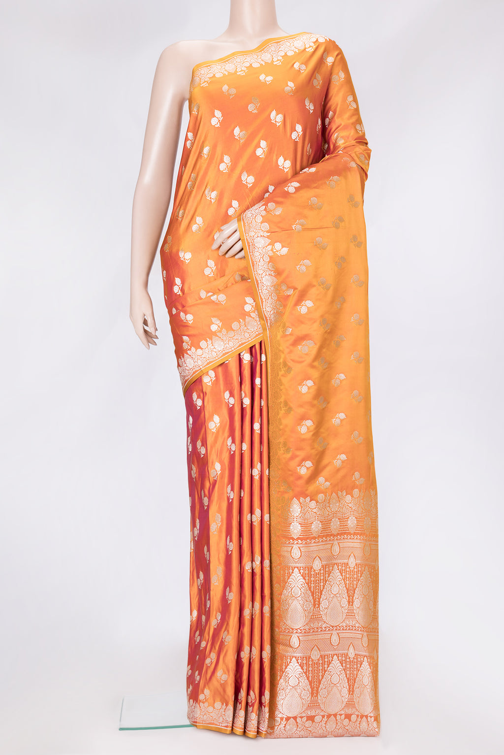 Coral Dual Tone Banarasi Silk Saree with Zari Butta on the body and Fancy Border.  displayed on a mannequin