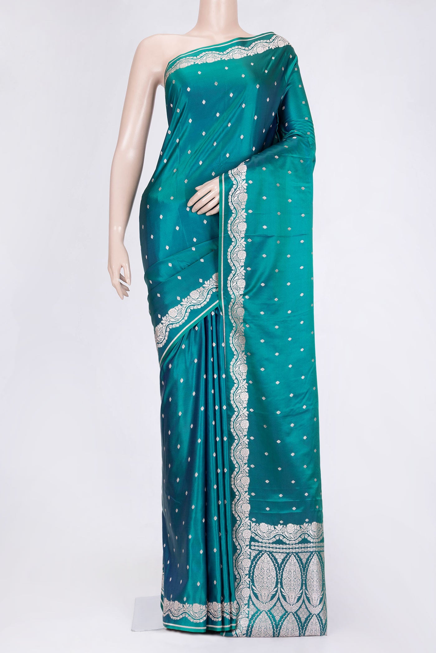 Peacock Blue Dual Tone Blended Banarasi Saree with Zari Butta on the body and Zari Border.  displayed on a mannequin