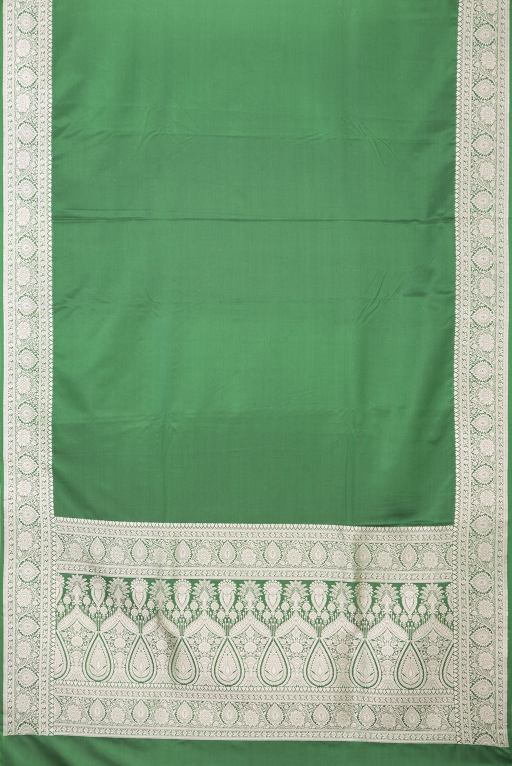 Flat view of Bottle Green Blended Banarasi Silk Saree with Plain Body and Zari Border. 
