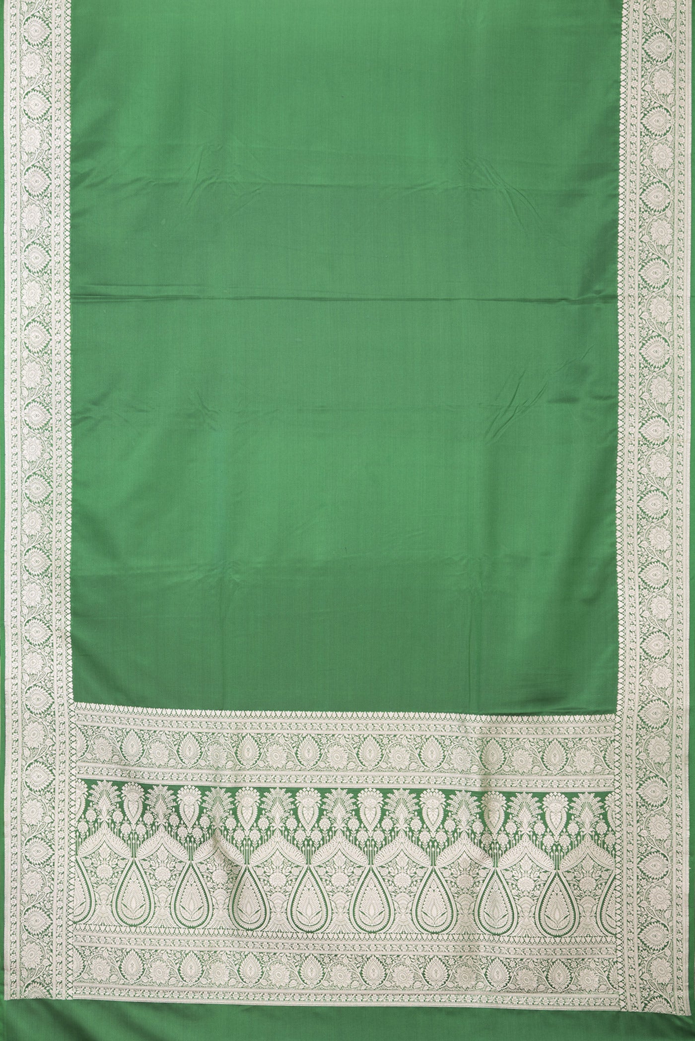 Flat view of Bottle Green Blended Banarasi Silk Saree with Plain Body and Zari Border. 