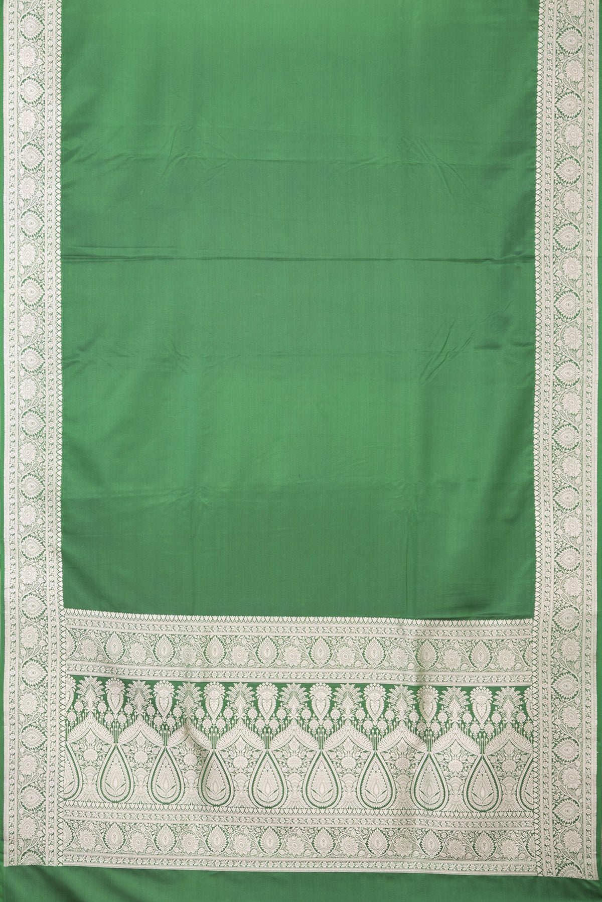 Flat view of Bottle Green Blended Banarasi Silk Saree with Plain Body and Zari Border. 