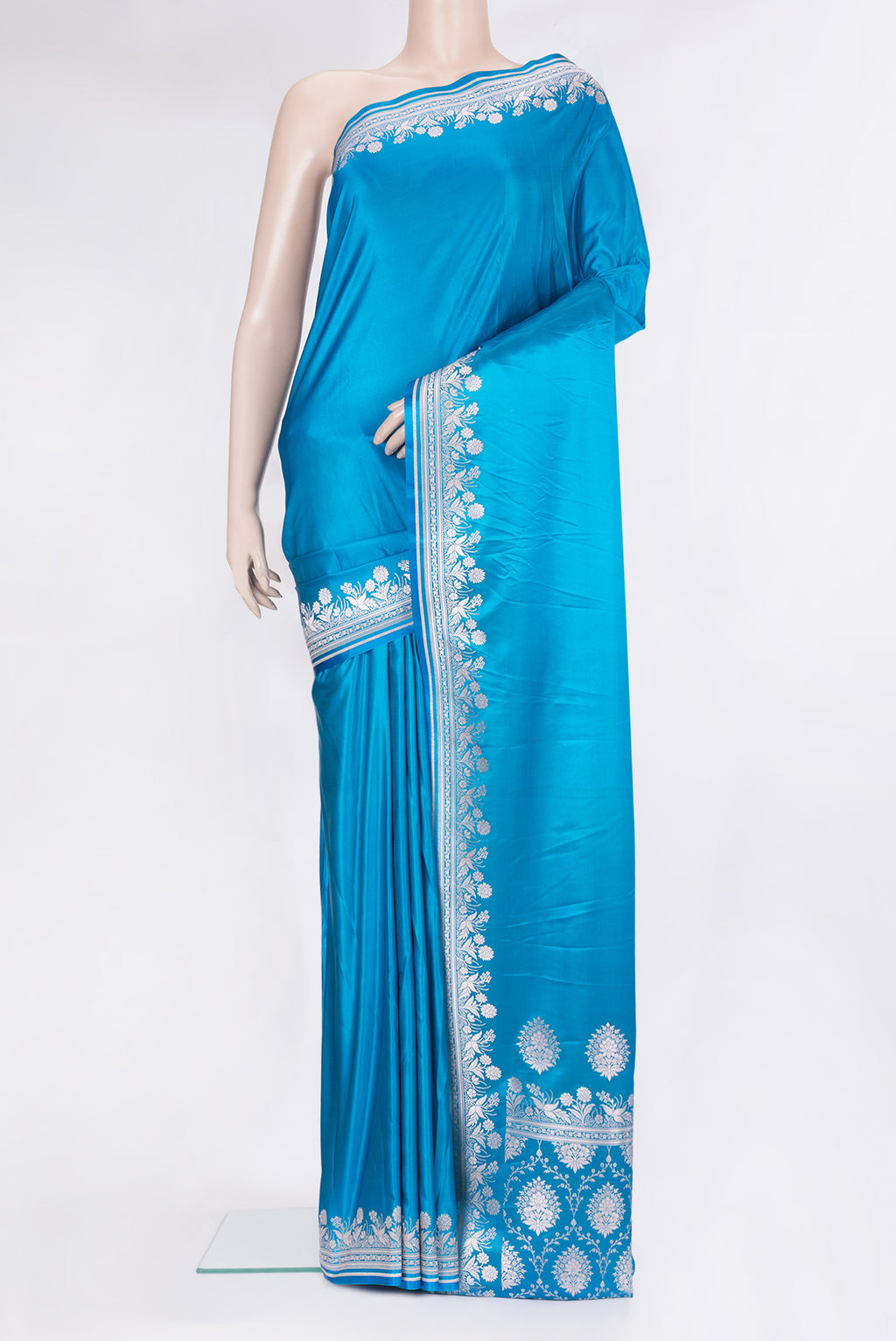 Sky Blue Blended Banarasi Silk Saree with Plain Body and Zari Border.  displayed on a mannequin