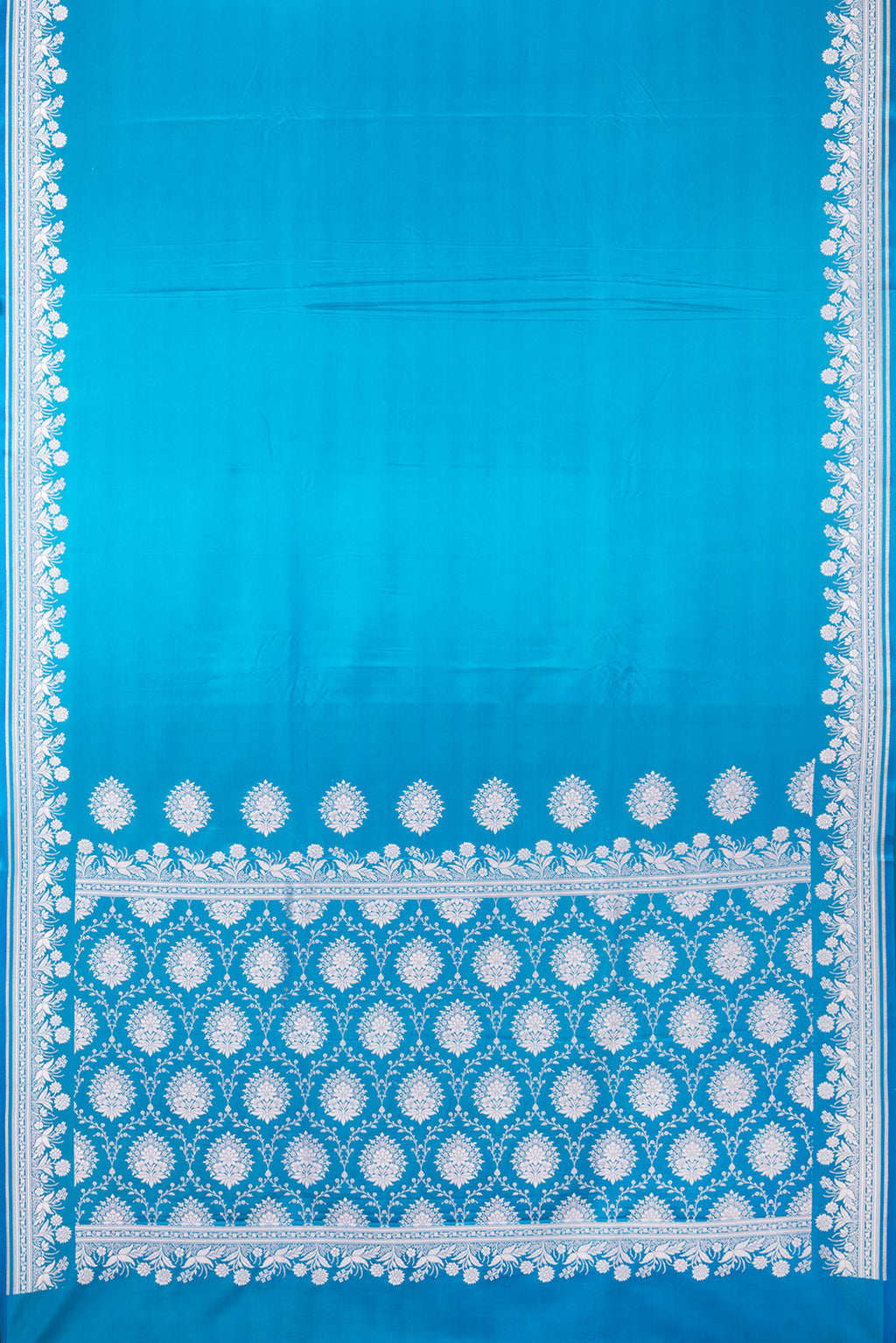 Flat view of Sky Blue Blended Banarasi Silk Saree with Plain Body and Zari Border. 