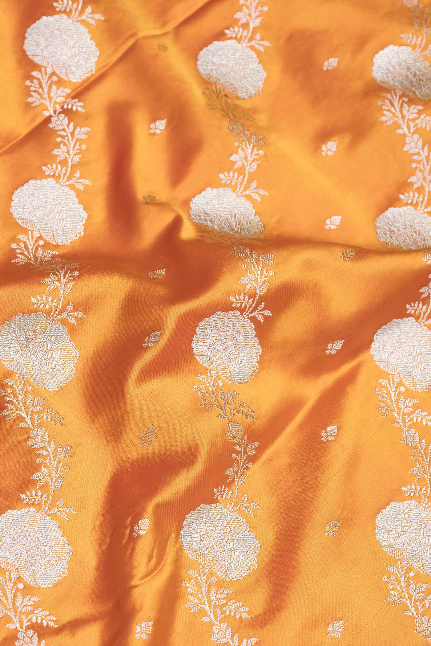 Close up of Yellow Dual Tone Blended Banarasi Saree with Zari Brocade on the body and Zari Border.  displaying folds