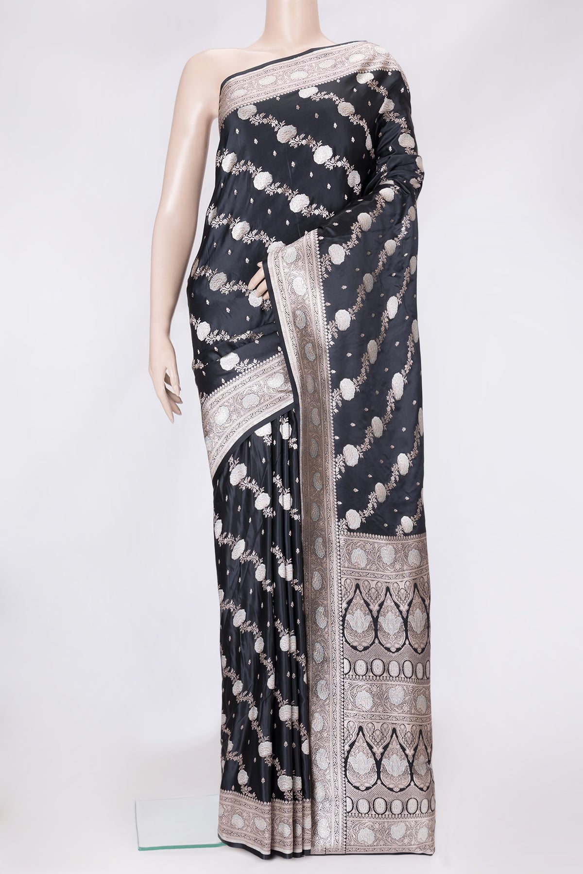 Black Dual Tone Banarasi Silk Saree with Zari Butta on the body and Fancy Border.  displayed on a mannequin