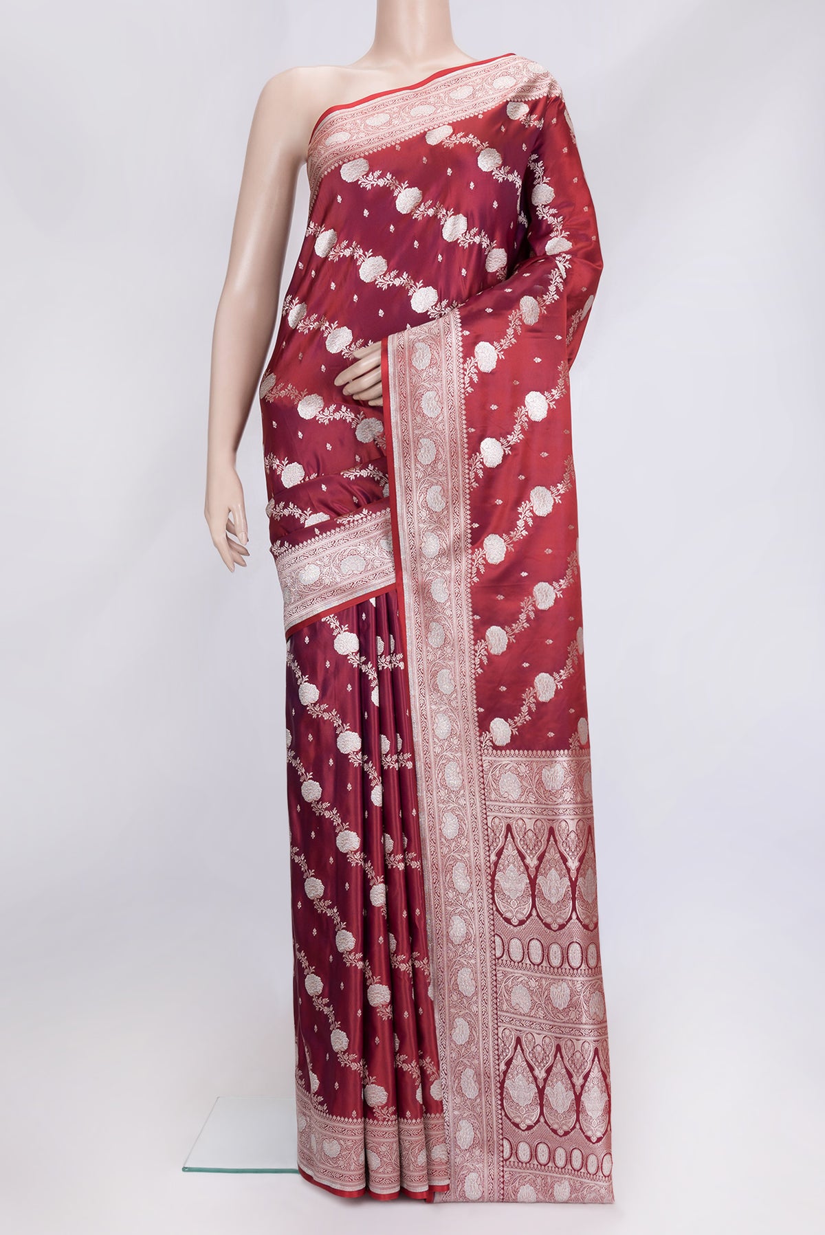 Maroon Dual Tone Blended Banarasi Silk Saree with Zari Brocade on the body and Zari Border.  displayed on a mannequin