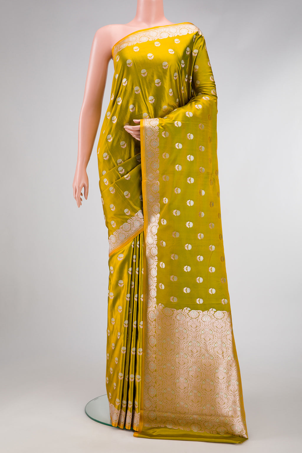 Mehandi Green Dual Tone Blended Banarasi Silk Saree with Zari Butta on the body and Zari Border.  displayed on a mannequin