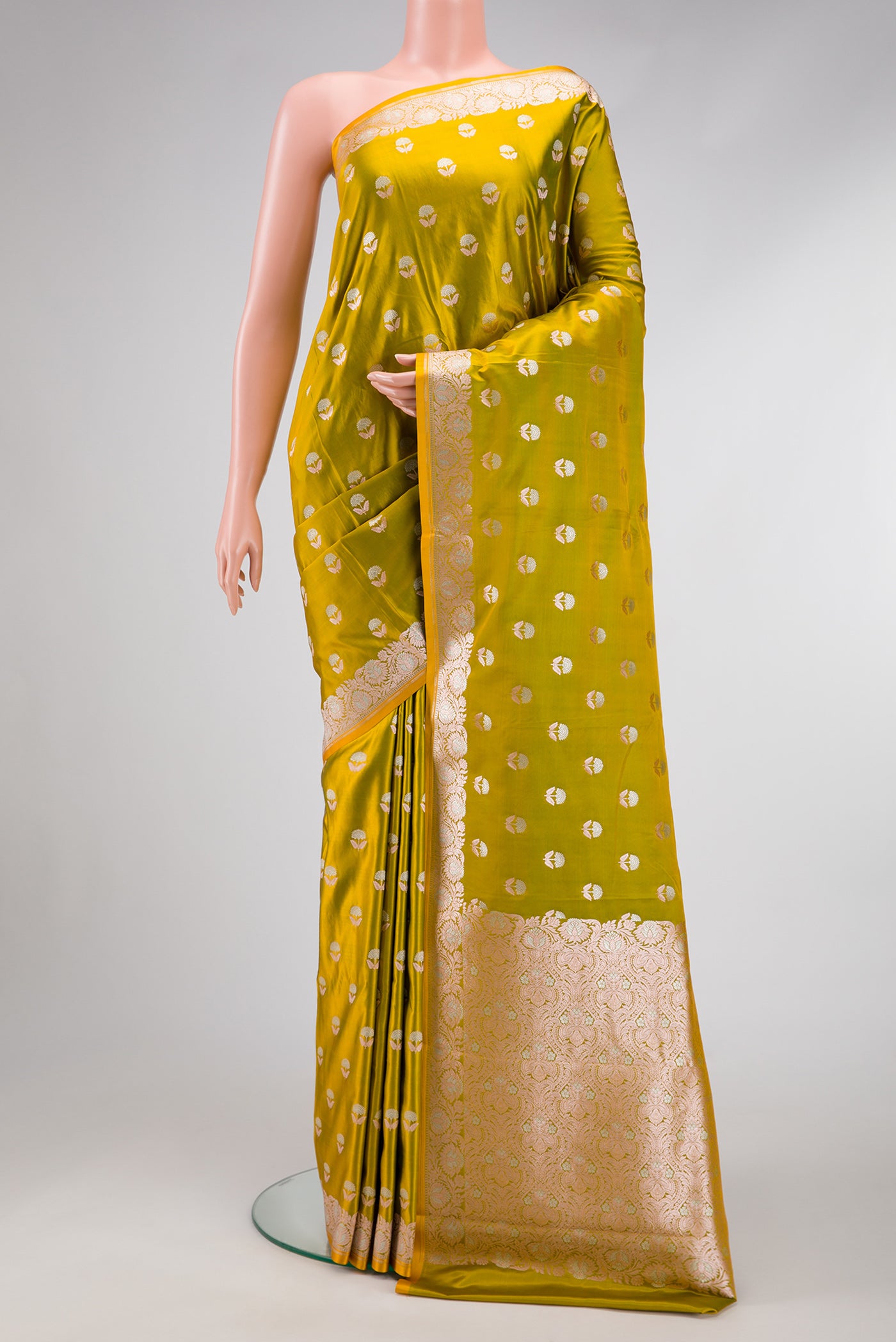 Mehandi Green Dual Tone Blended Banarasi Silk Saree with Zari Butta on the body and Zari Border.  displayed on a mannequin