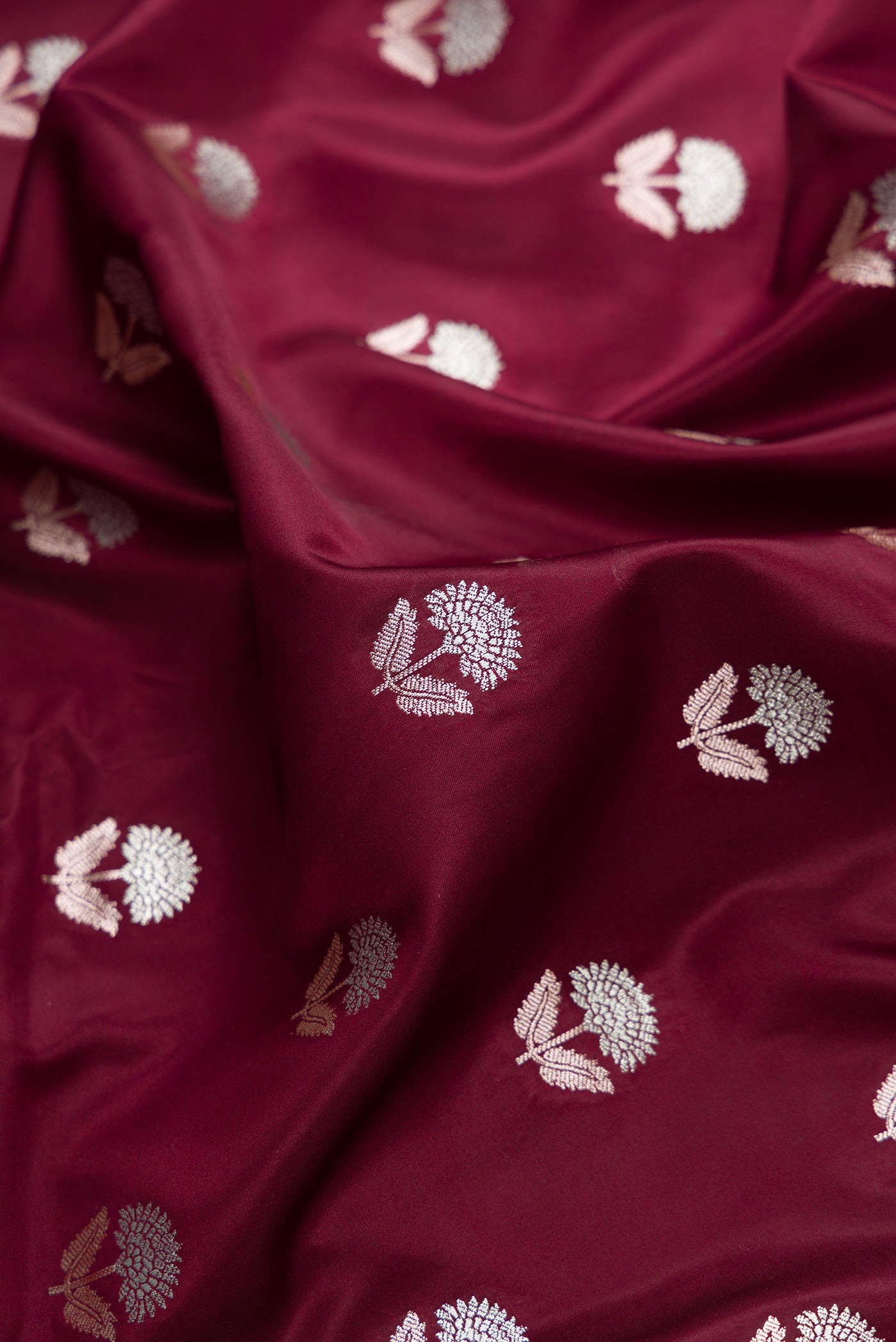 Close up of Coffee Brown Dual Tone Blended Banarasi Silk Saree with Zari Butta on the body and Zari Border.  displaying folds