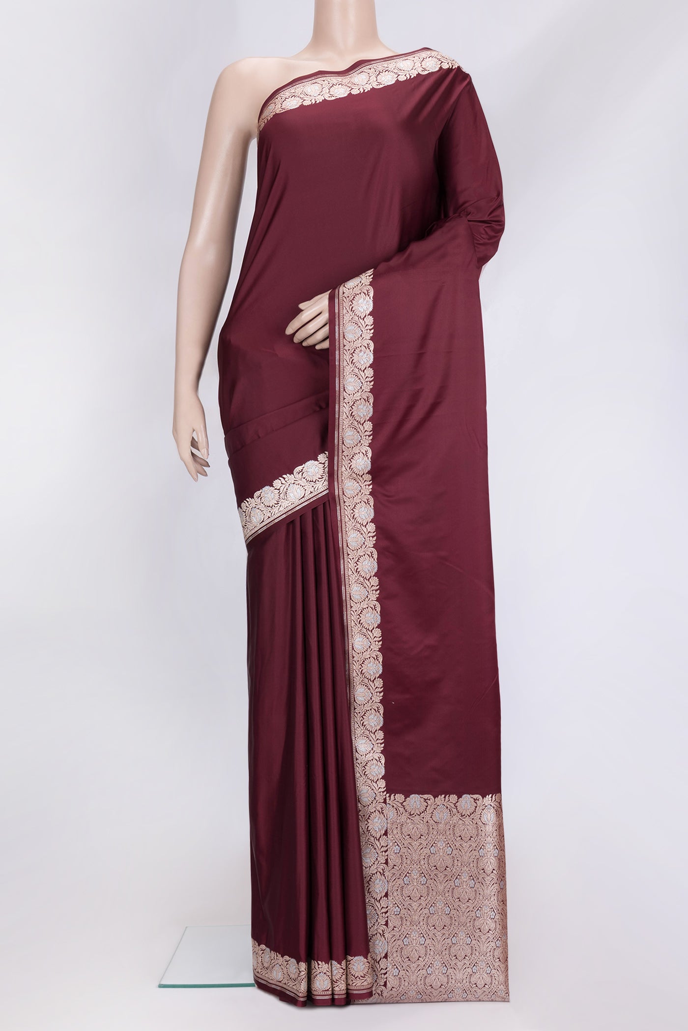 Maroon Dual Tone Blended Banarasi Silk Saree with Plain Body and Zari Border.  displayed on a mannequin