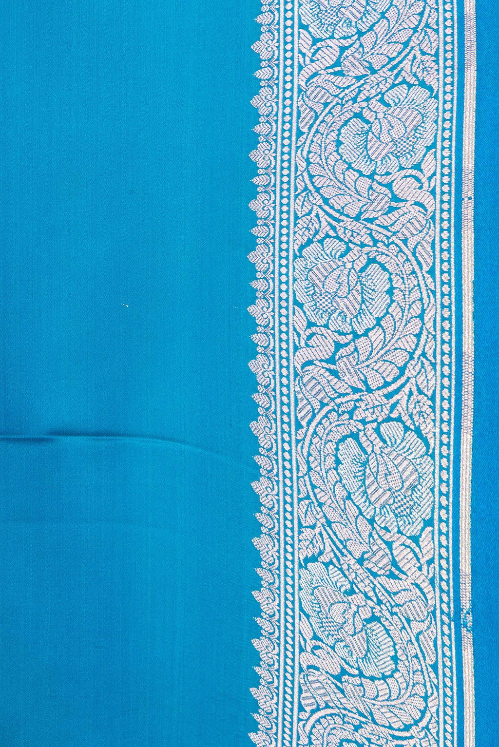 Border image of Sky Blue Dual Tone Banarasi Silk Saree with Plain Body and Zari Border. 