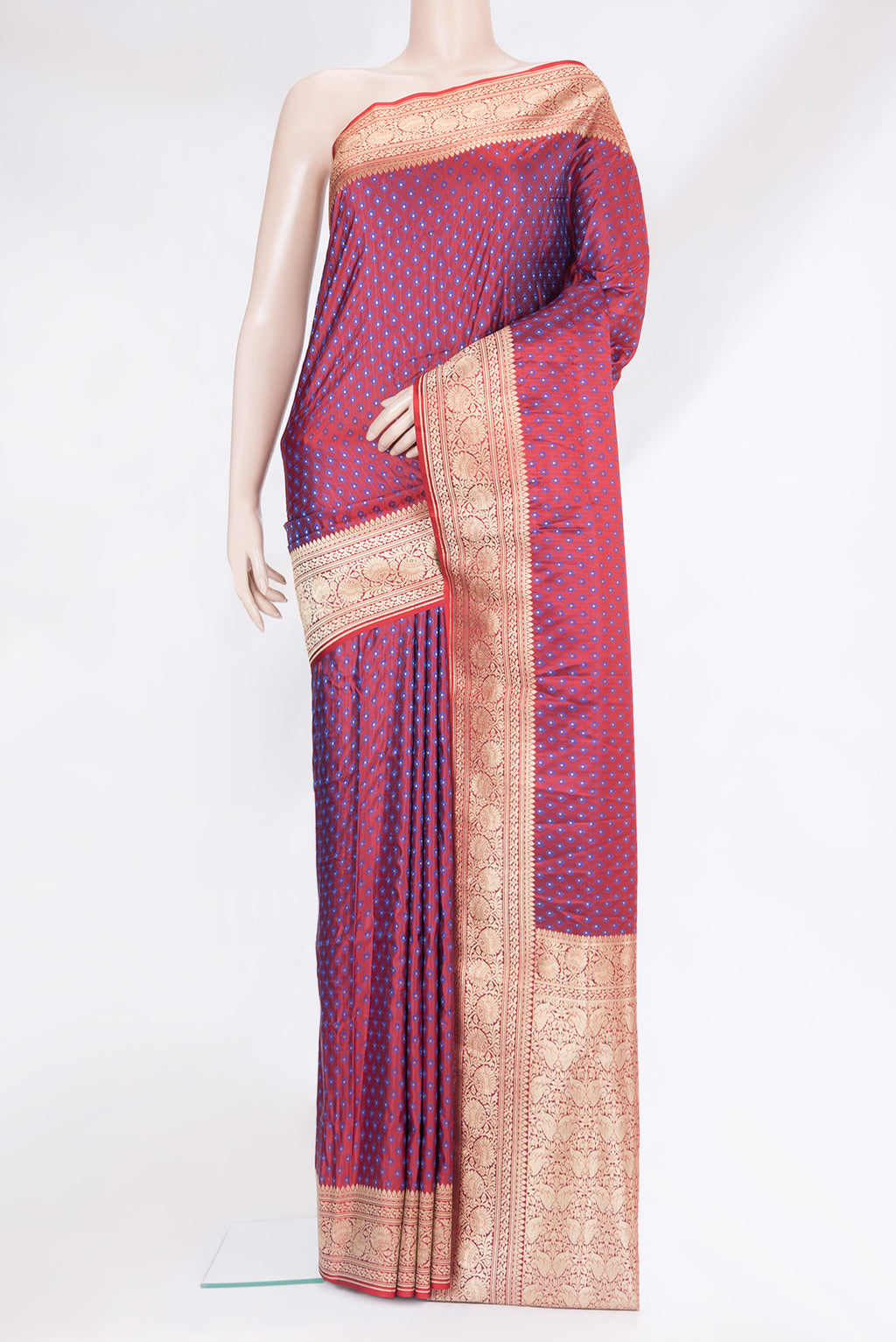 Maroon Blended Banarasi Silk Saree with Zari And Thread Butta on the body and Zari Border.  displayed on a mannequin
