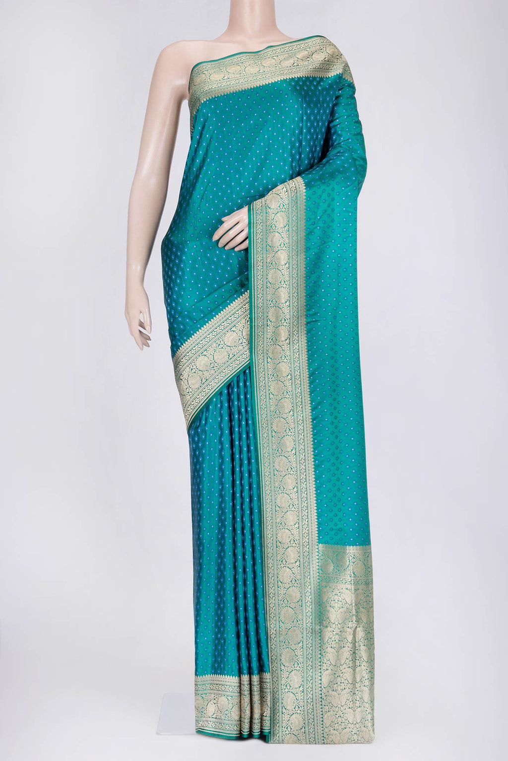 Peacock Blue Dual Tone Blended Banarasi Saree with Zari And Thread Butta on the body and Zari Border.  displayed on a mannequin