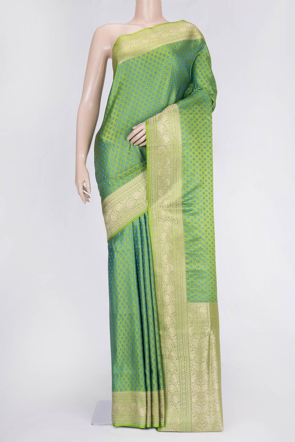 Parrot Green Dual Tone Blended Banarasi Saree with Zari And Thread Butta on the body and Zari Border.  displayed on a mannequin