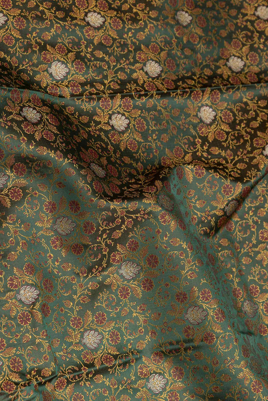 Close up of Bottle Green Dual Tone Blended Banarasi Saree with Jacquard With Zari Butta on the body and Zari Border.  displaying folds
