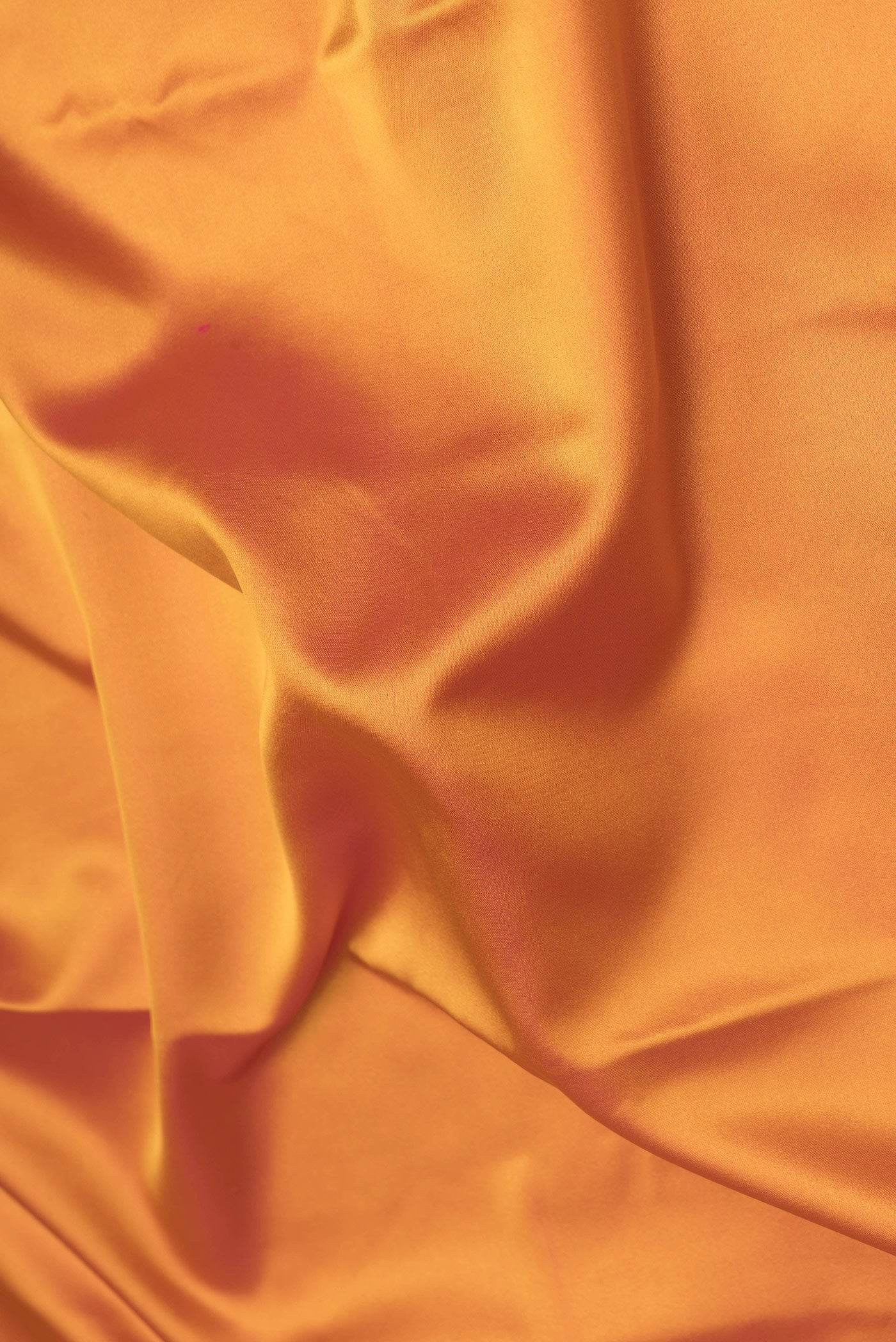 Close up of Yellow Dual Tone Banarasi Silk Saree with Plain Body and Fancy Border.  displaying folds