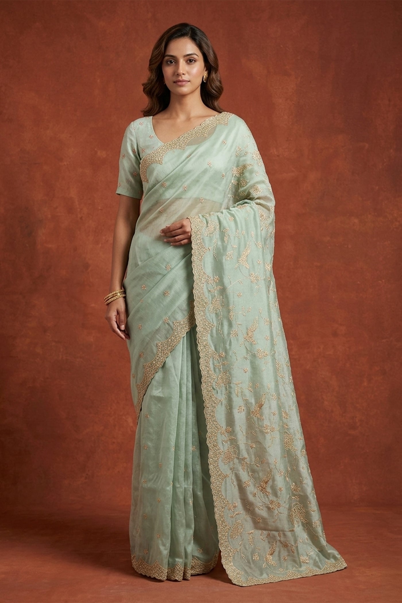 Model wearing a Light Blue Dual Tone Blended Organza Silk Saree with Embroidery on the body and Embroidery Border.