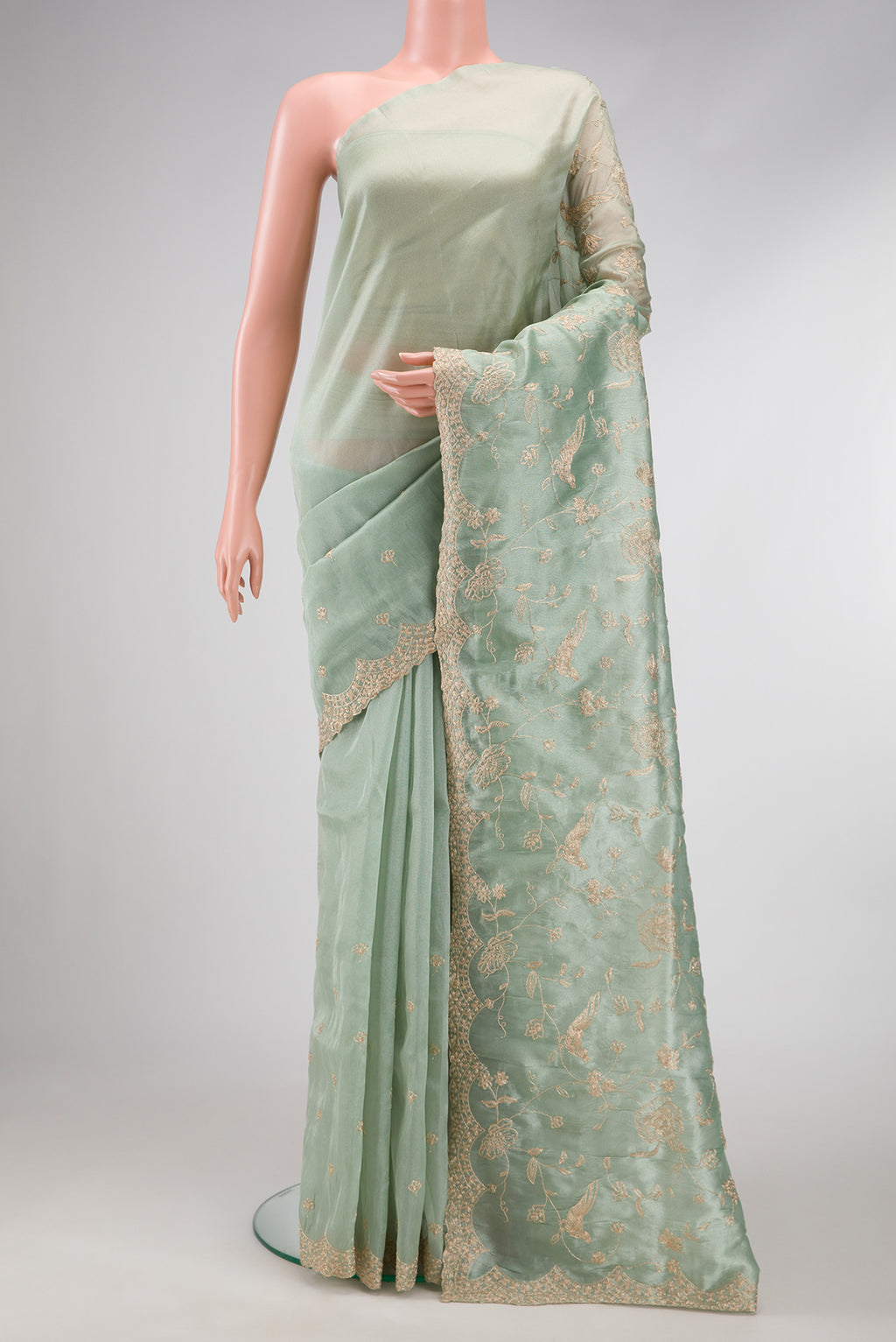 Sea Green Dual Tone Blended Organza Silk Saree with Embroidery on the body and Embroidery Border.  displayed on a mannequin