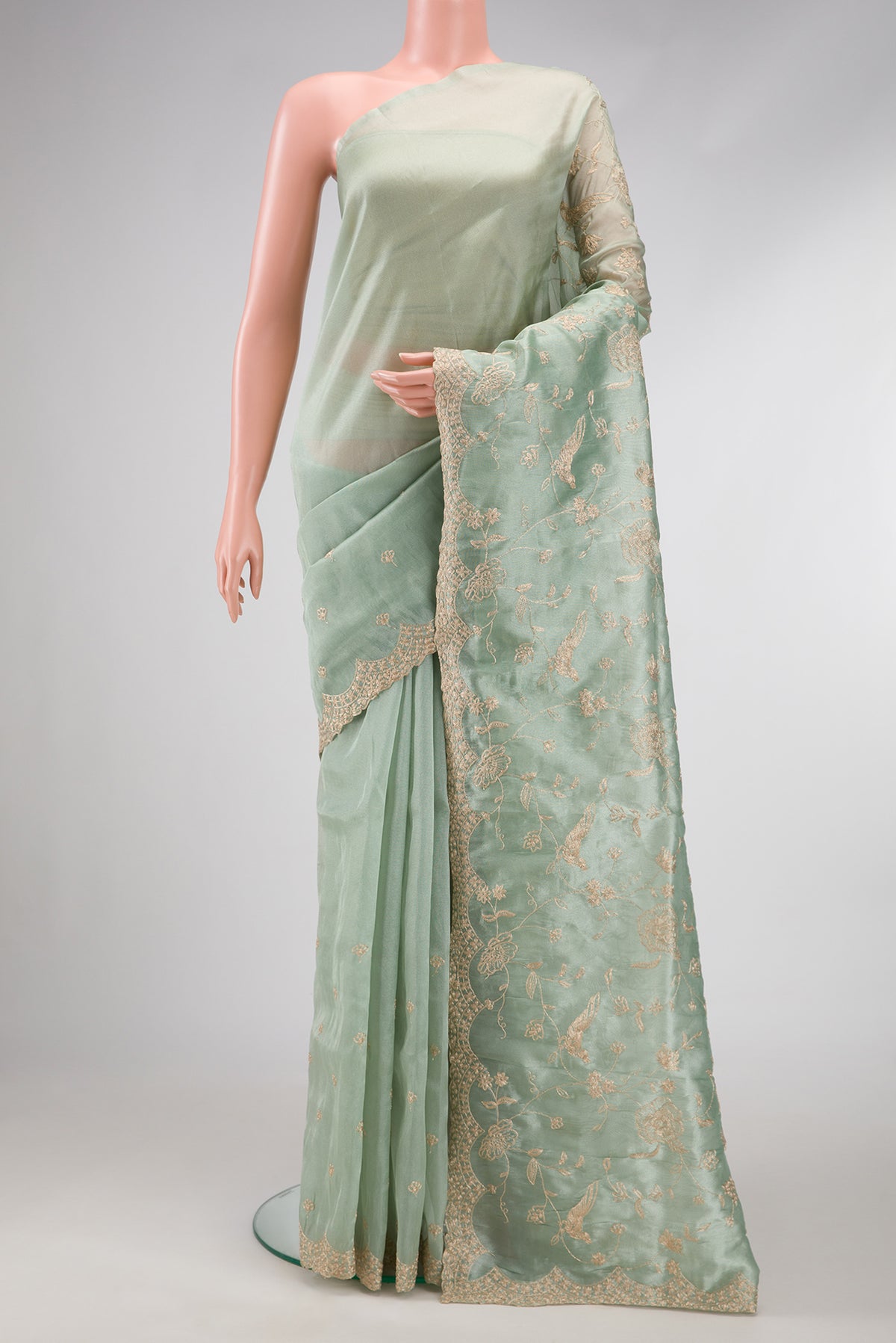 Sea Green Dual Tone Blended Organza Silk Saree with Embroidery on the body and Embroidery Border.  displayed on a mannequin