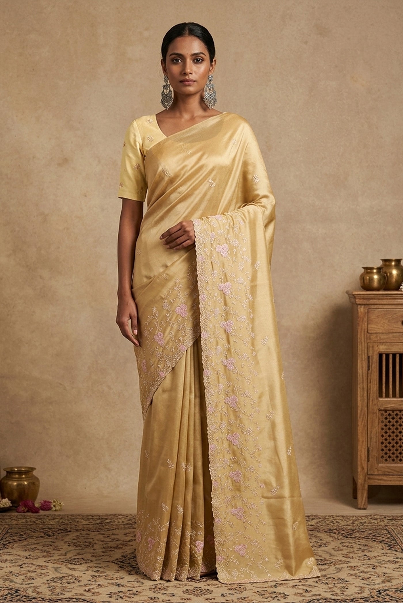Model wearing a Sandal Blended Organza Silk Saree with Embroidery on the body and Embroidery Border.