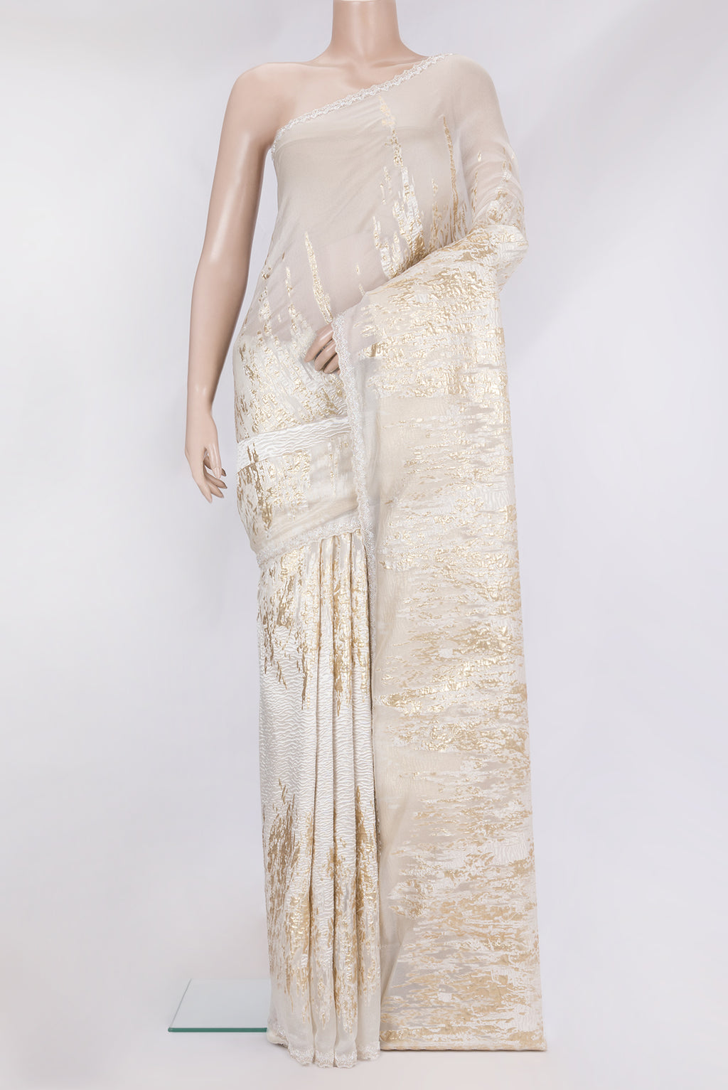 Off White Organza Silk Saree with Zari Brocade on the body and Sequin Border.  displayed on a mannequin
