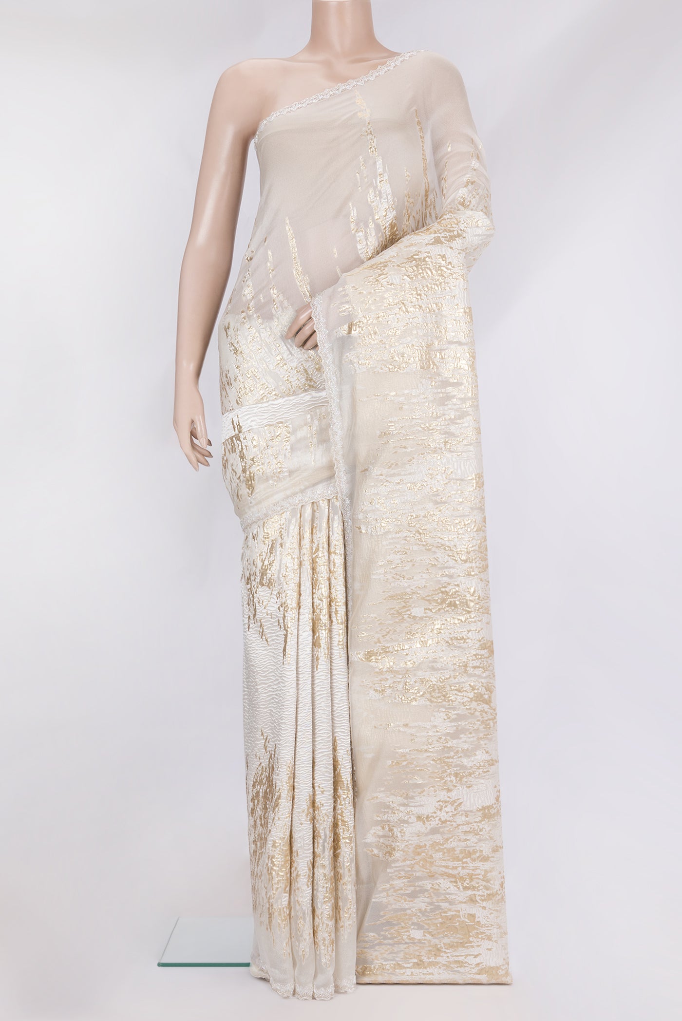 Off White Organza Silk Saree with Zari Brocade on the body and Sequin Border.  displayed on a mannequin