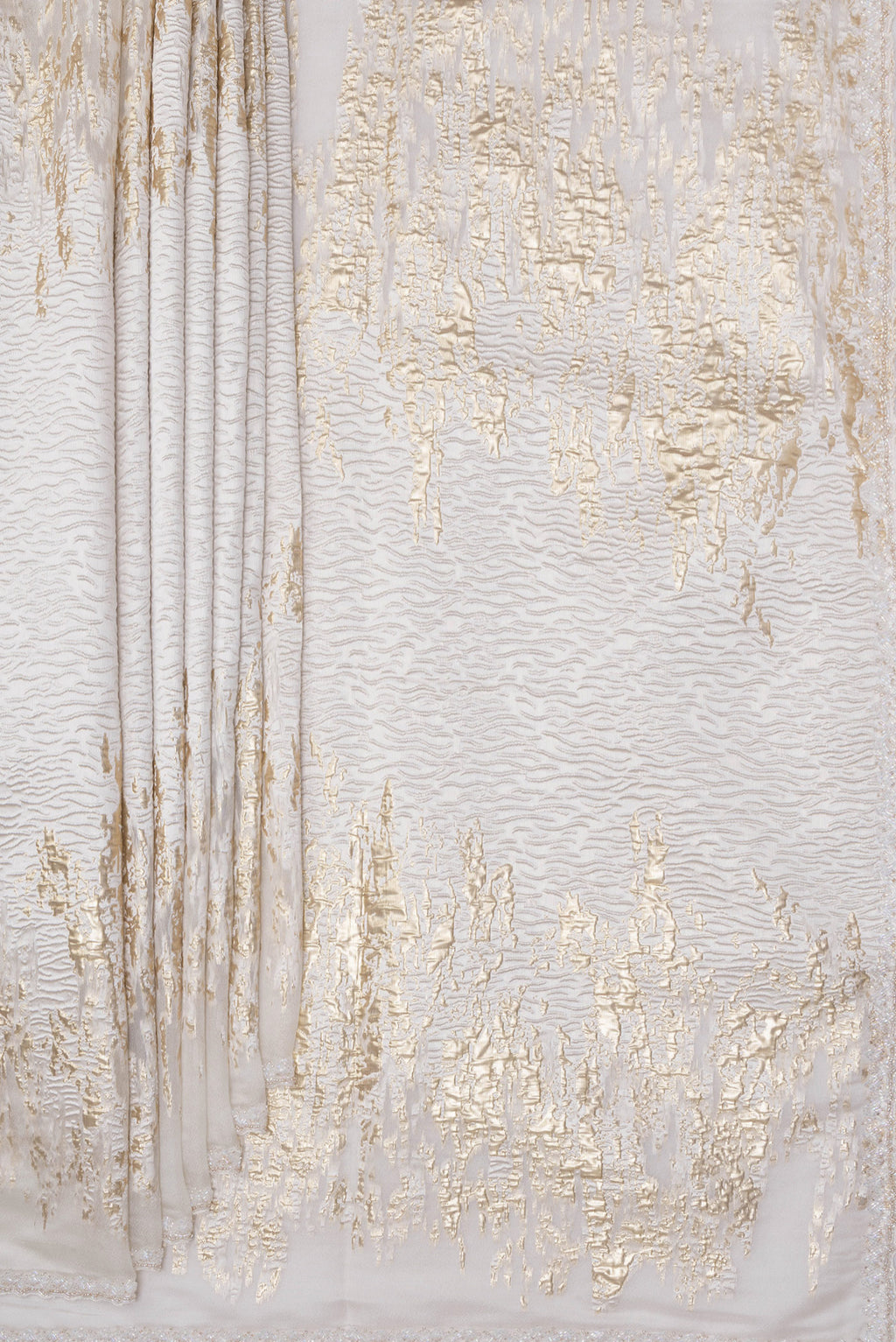 Pleats and pallu of Off White Organza Silk Saree with Zari Brocade on the body and Sequin Border. 