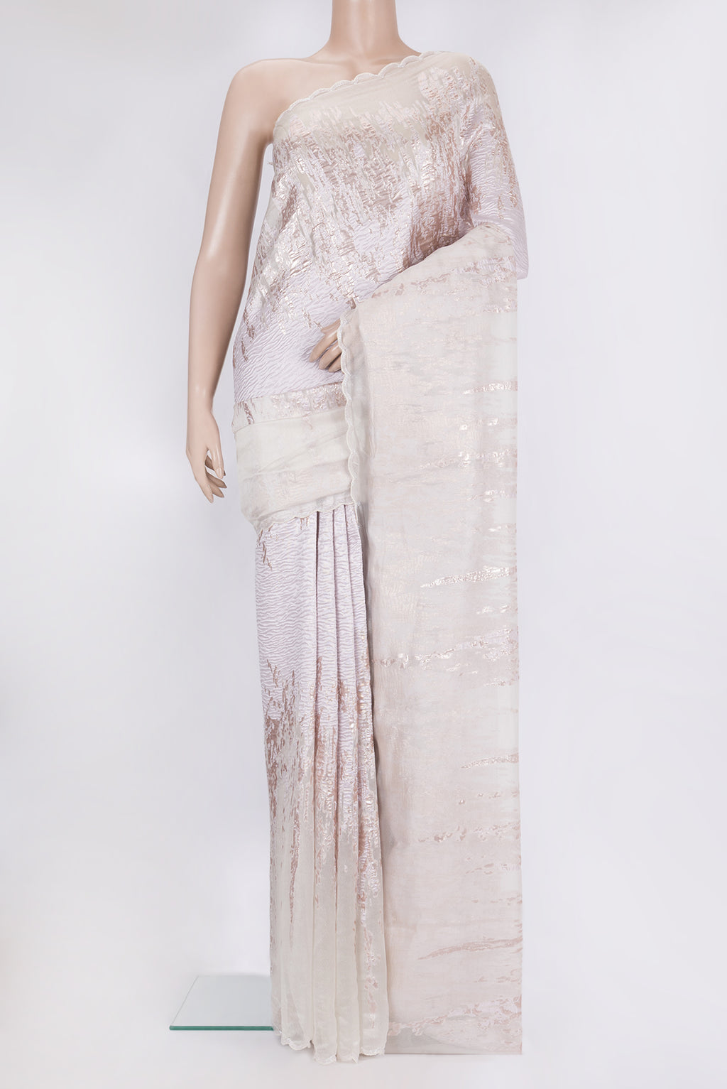 Off White Organza Silk Saree with Zari Brocade on the body and Sequin Border.  displayed on a mannequin